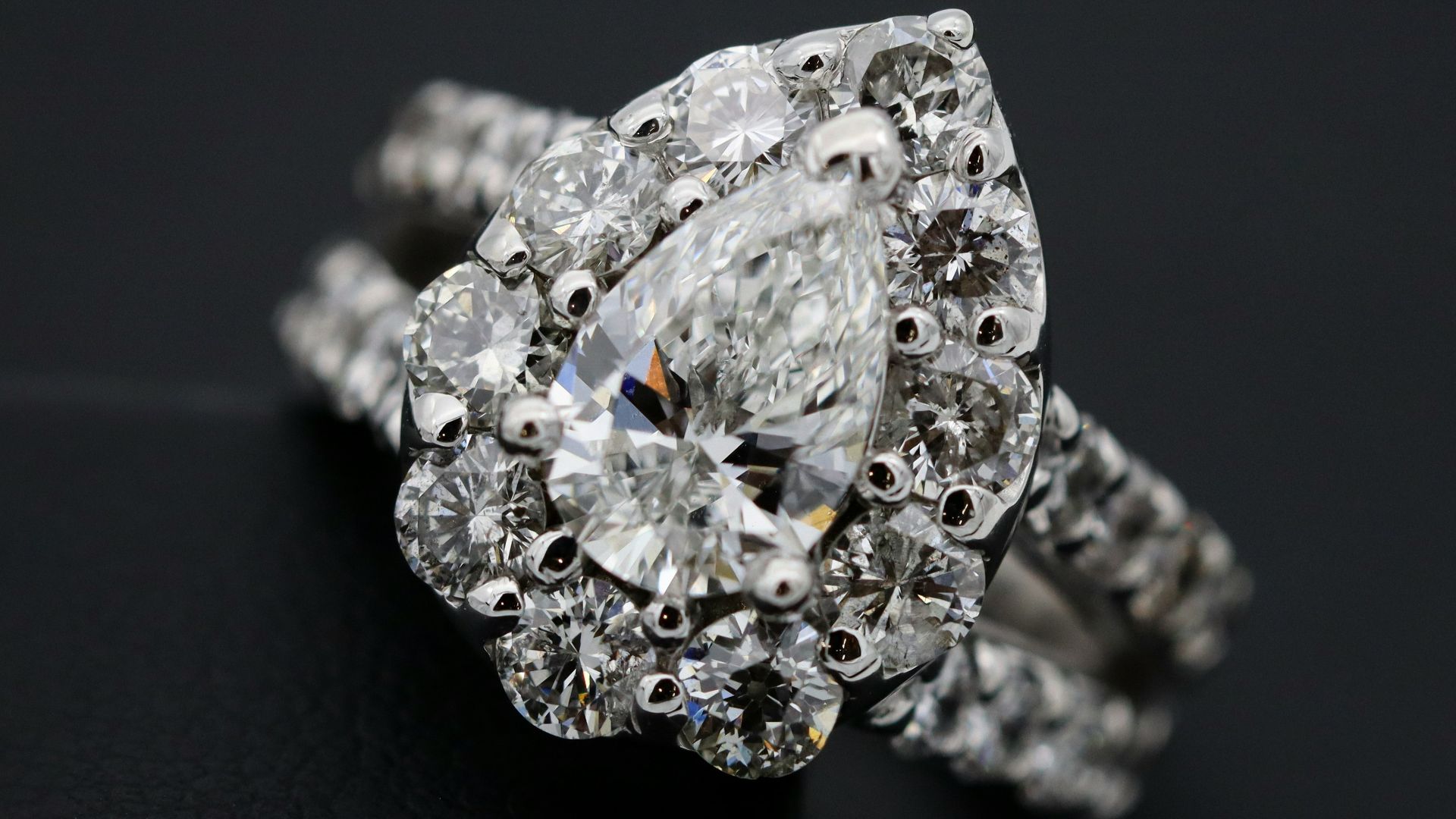 silver diamond studded ring on black textile