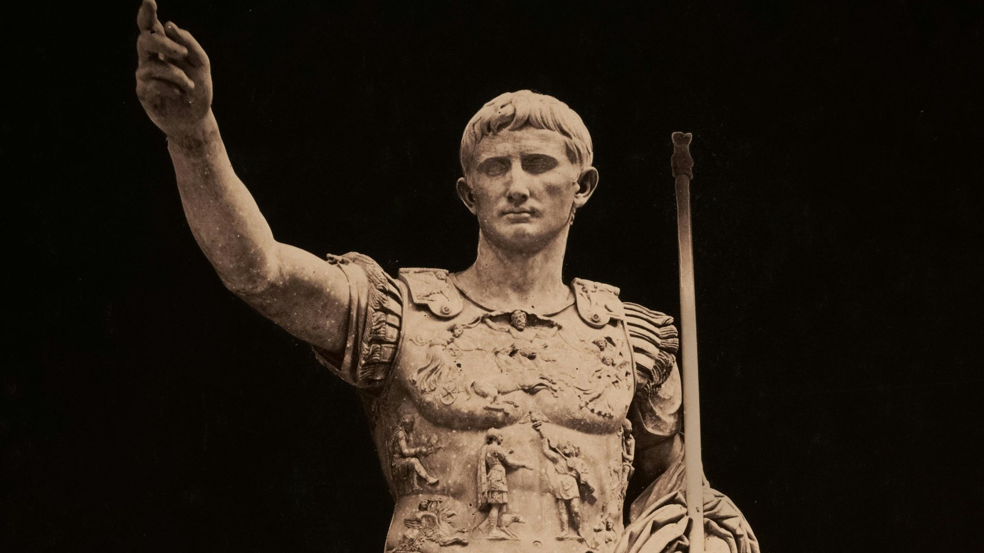 Statue of roman emperor augustus points upward.