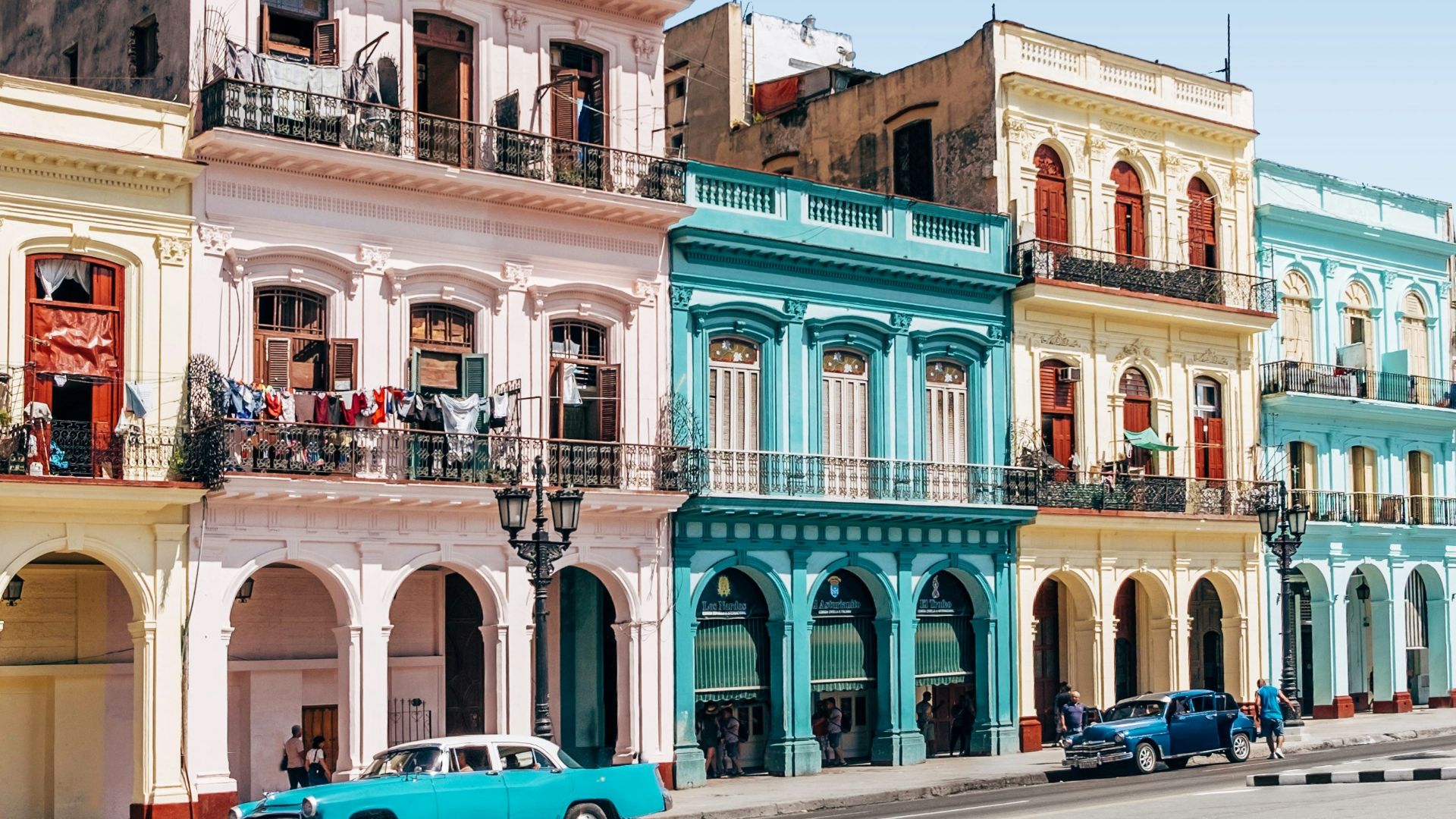 two cars parked outside building