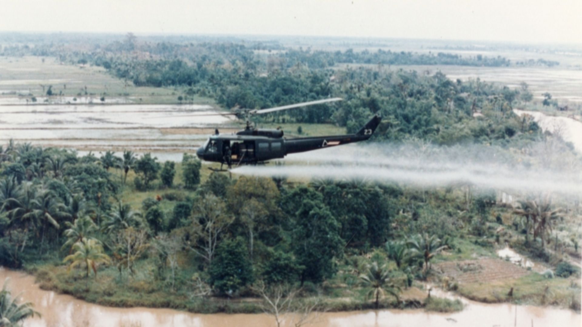 File:US-Huey-helicopter-spraying-Agent-Orange-in-Vietnam.jpg