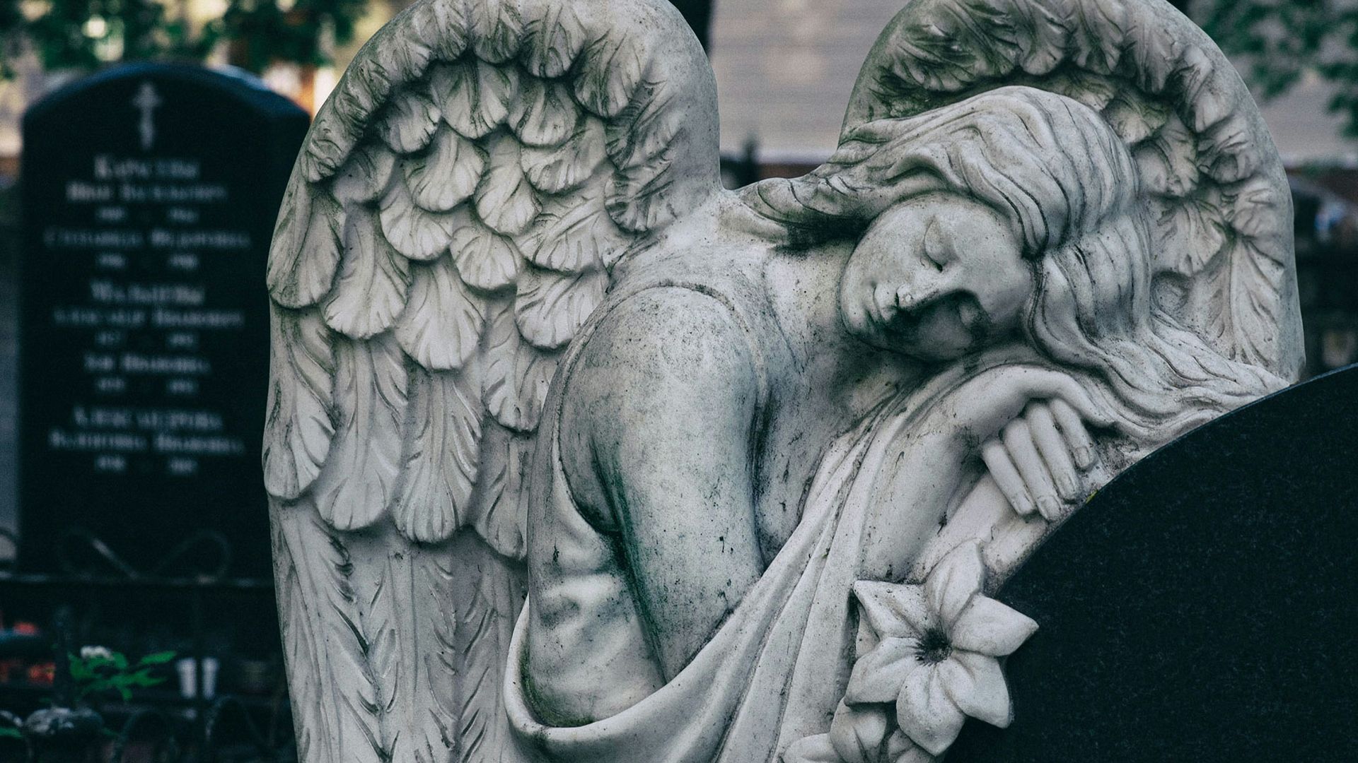 gray scale photo of angel statue