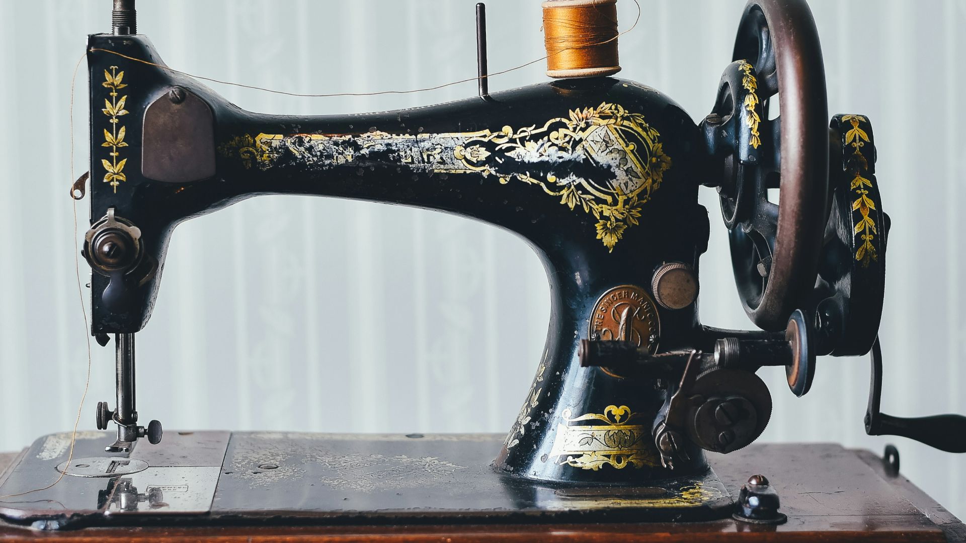 black and yellow metal sewing machine