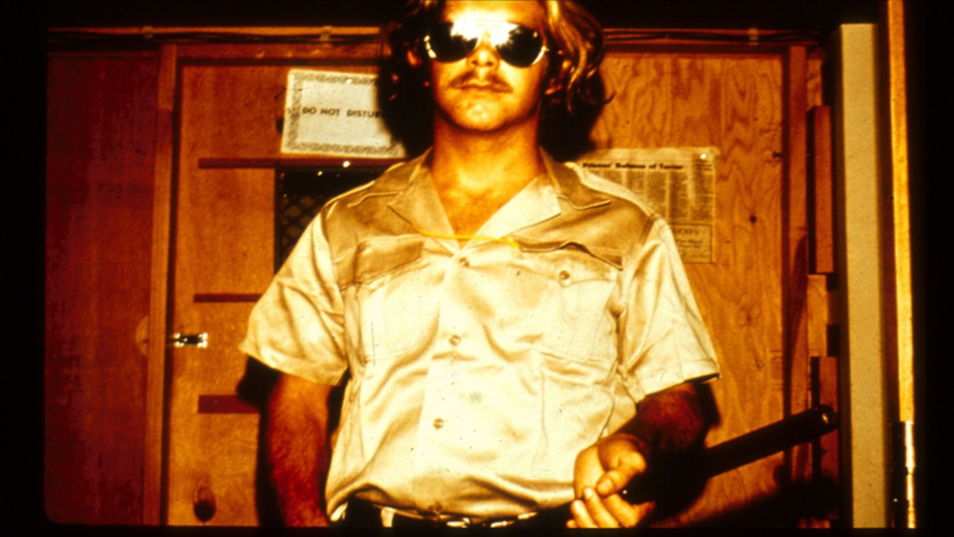 File:SPE1971-guard in uniform with mirrored sunglasses and billyclub.jpg