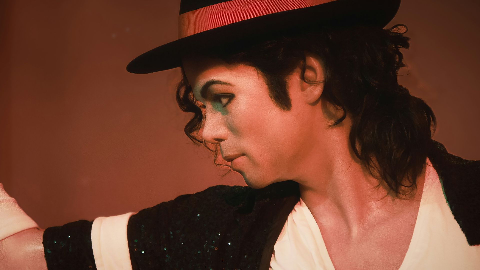 a man in a top hat and black jacket