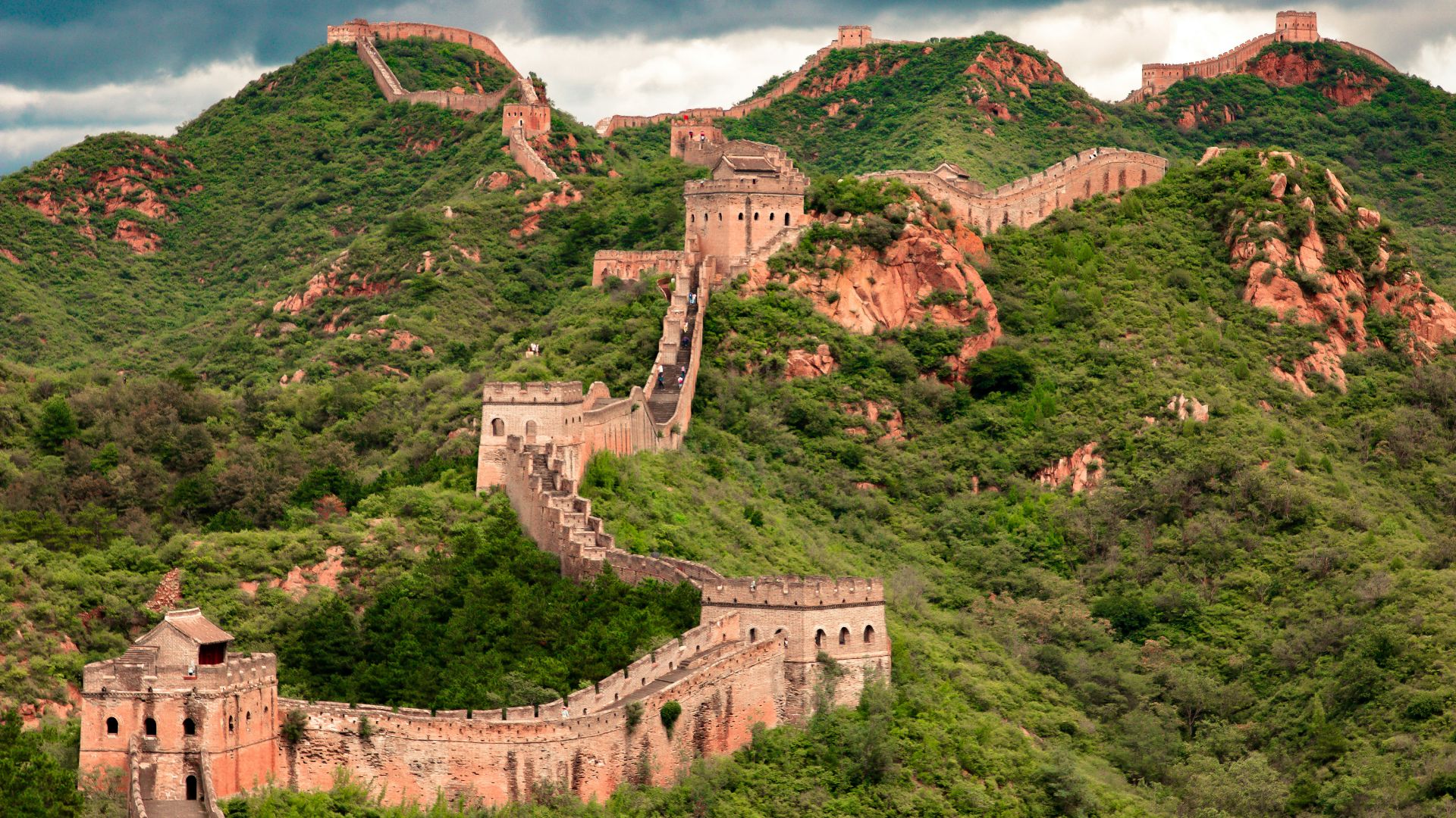 brown concrete building on top of hill
