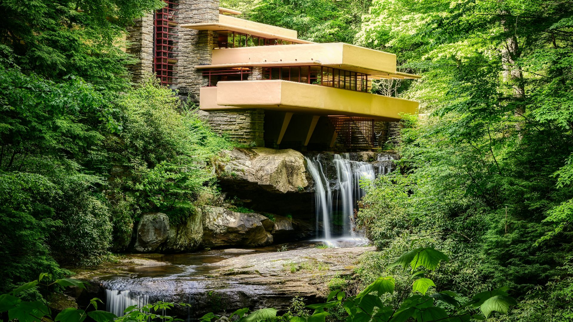brown wooden bridge over river