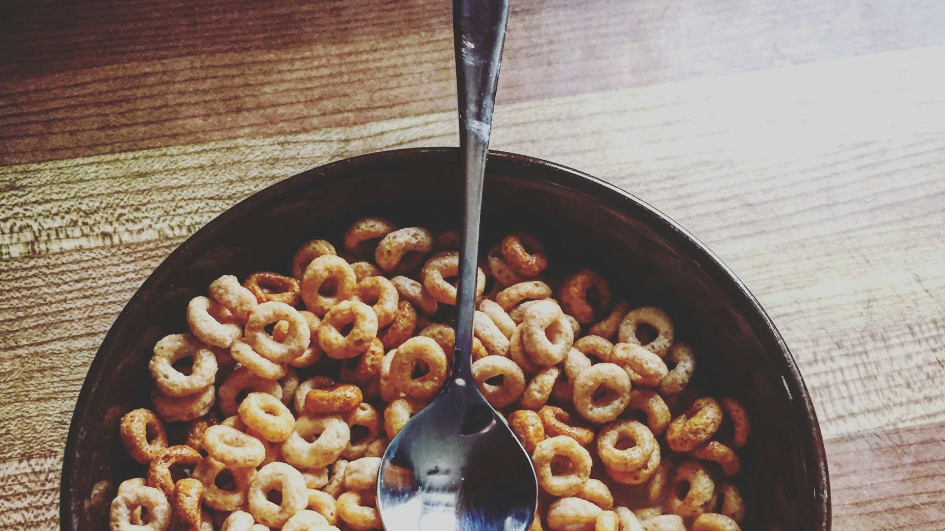 cereal dish on brown wooden surface