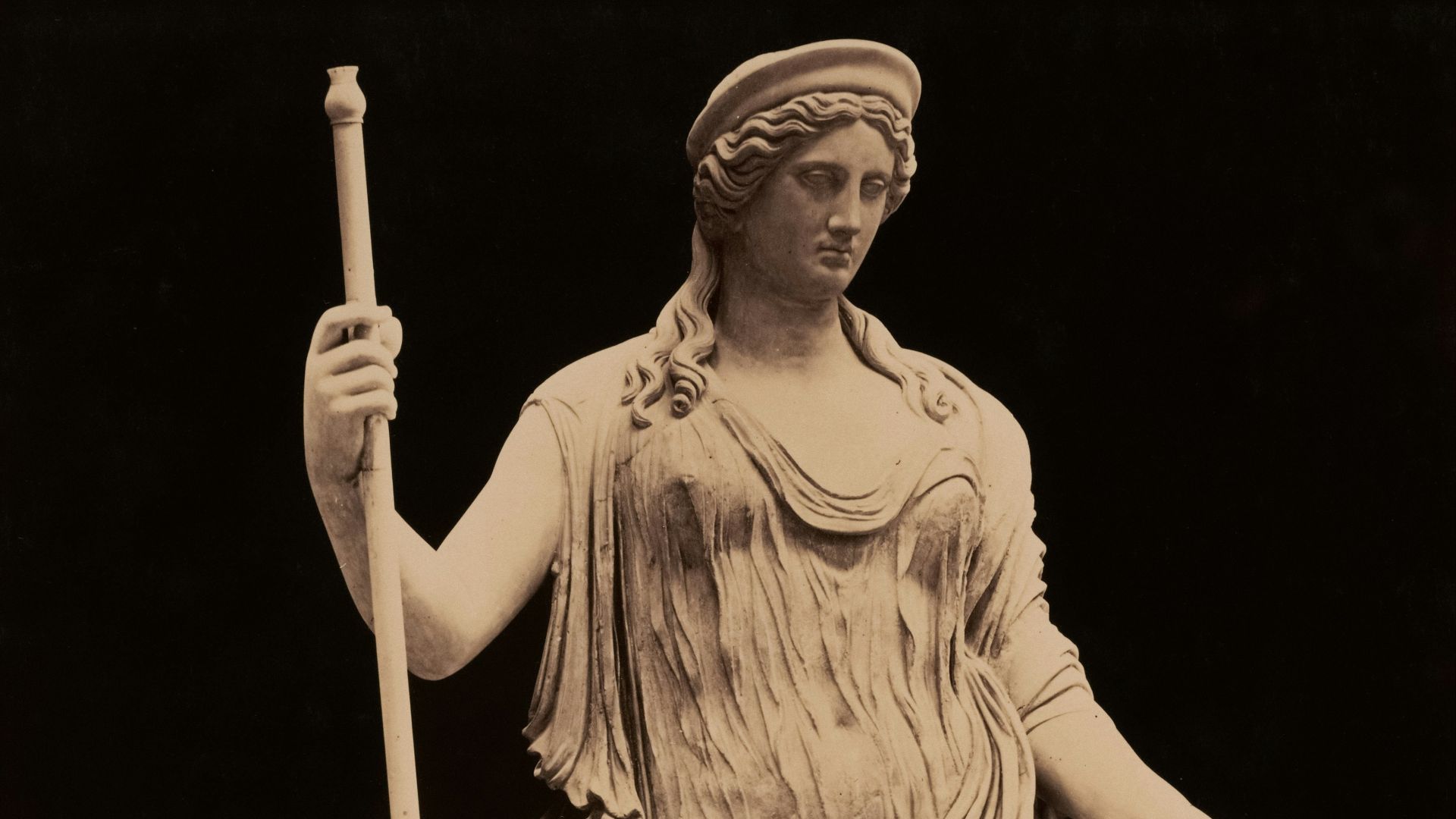 A beautiful statue of a goddess is pictured.