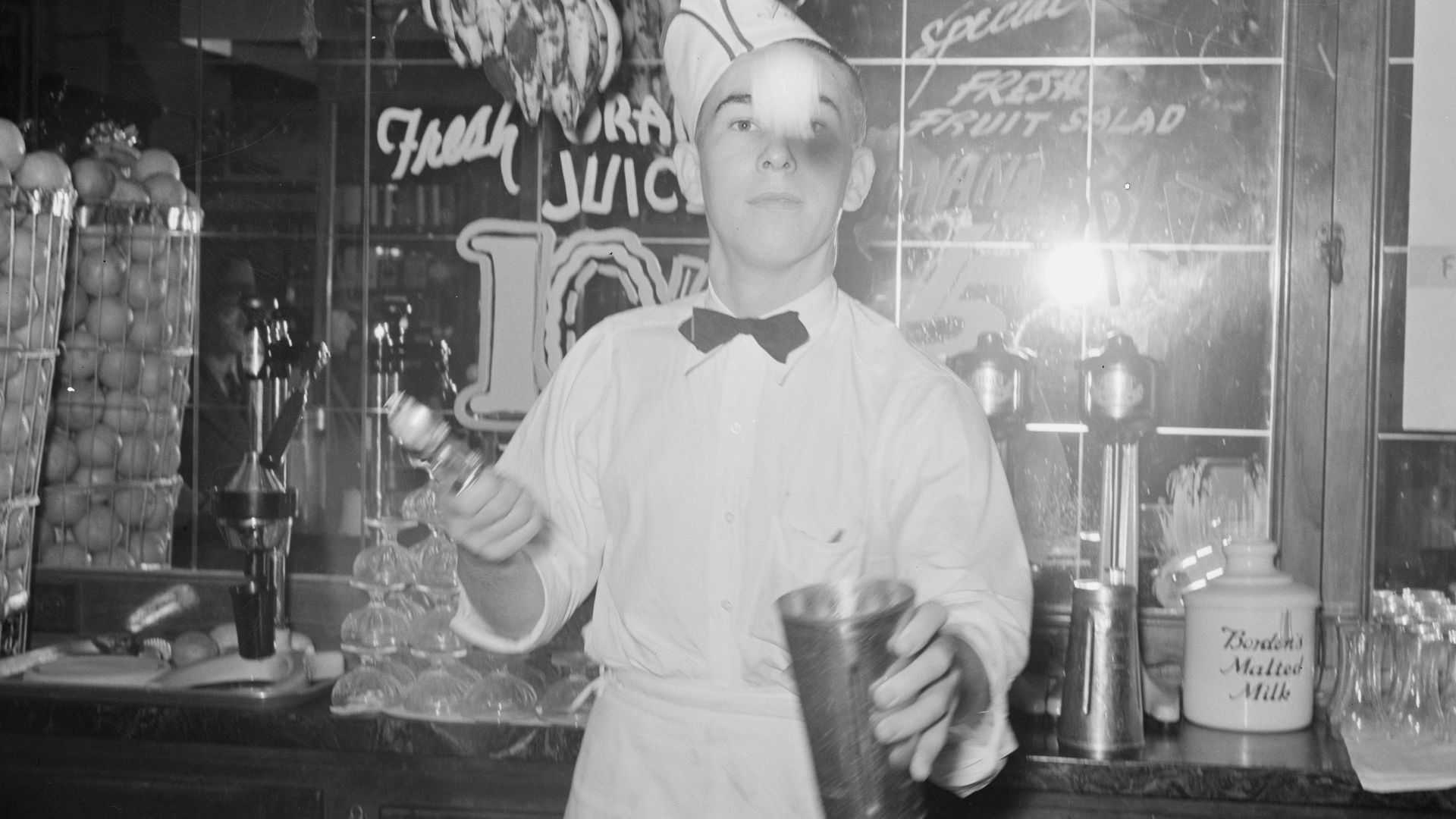 File:Soda jerker flipping ice cream into malted milk shakes. Corpus Christi, Texas.jpg