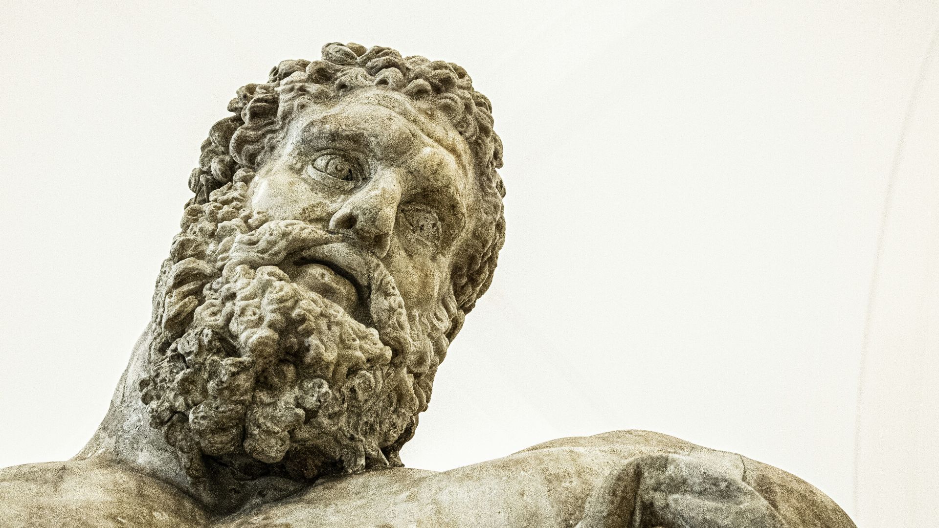 a close up of a statue of a man with a beard