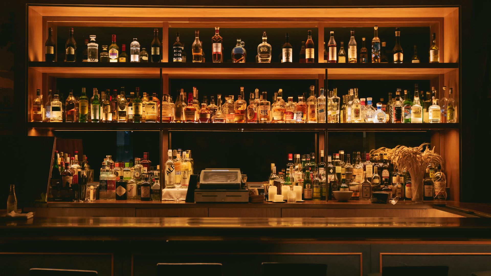 brown wooden shelf with bottles