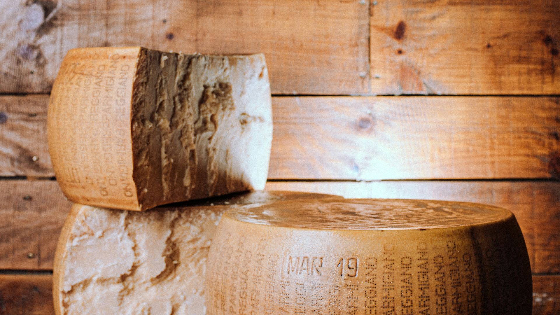 a couple of large pieces of cheese sitting on top of a table