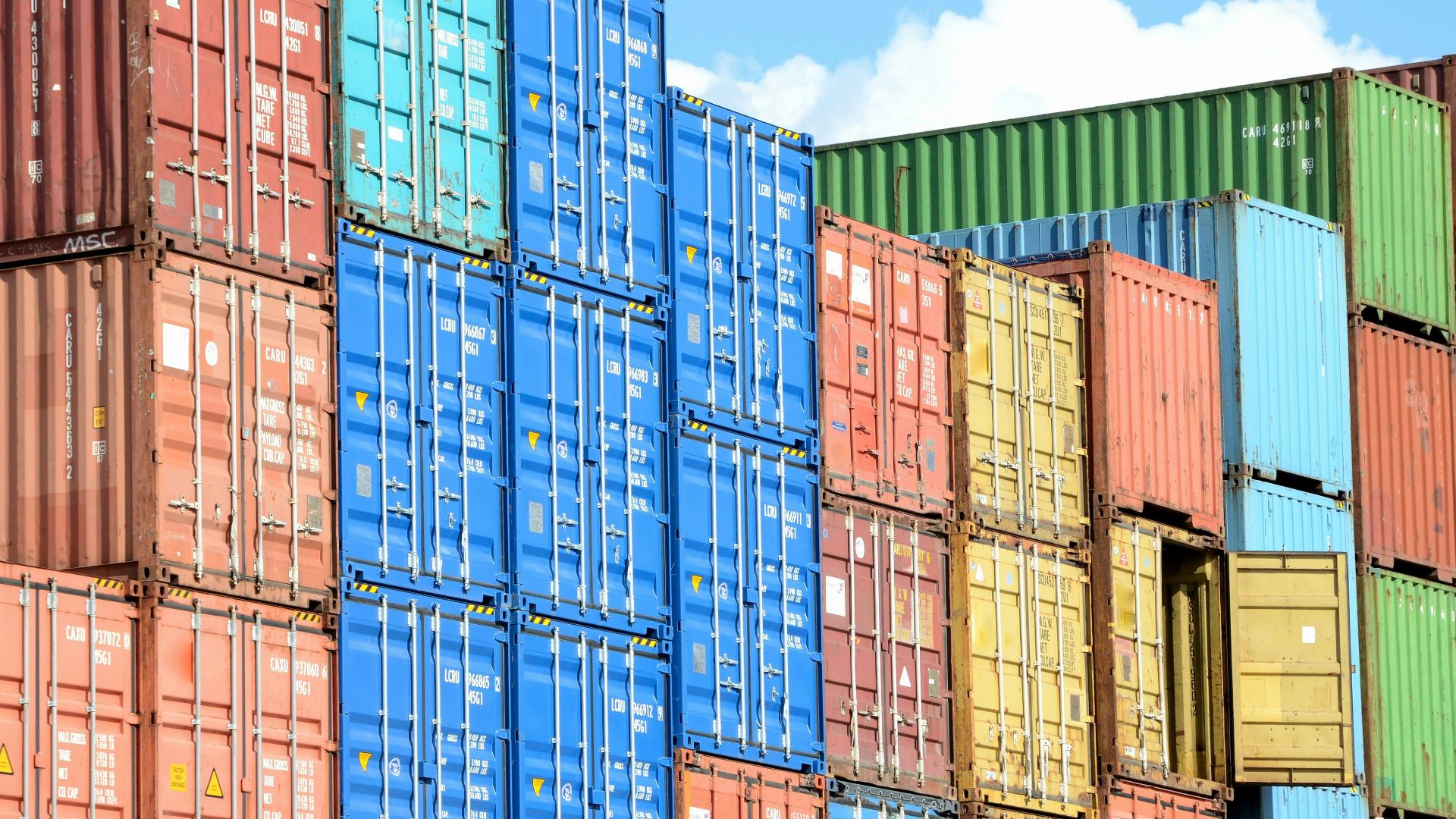 blue red and yellow intermodal containers