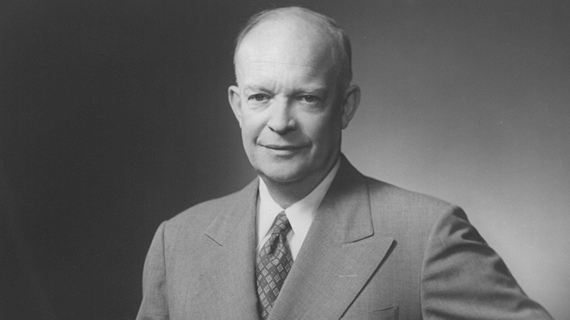 File:Dwight D. Eisenhower, three-quarter length portrait, standing, facing slightly left, hand on back of chair.jpg