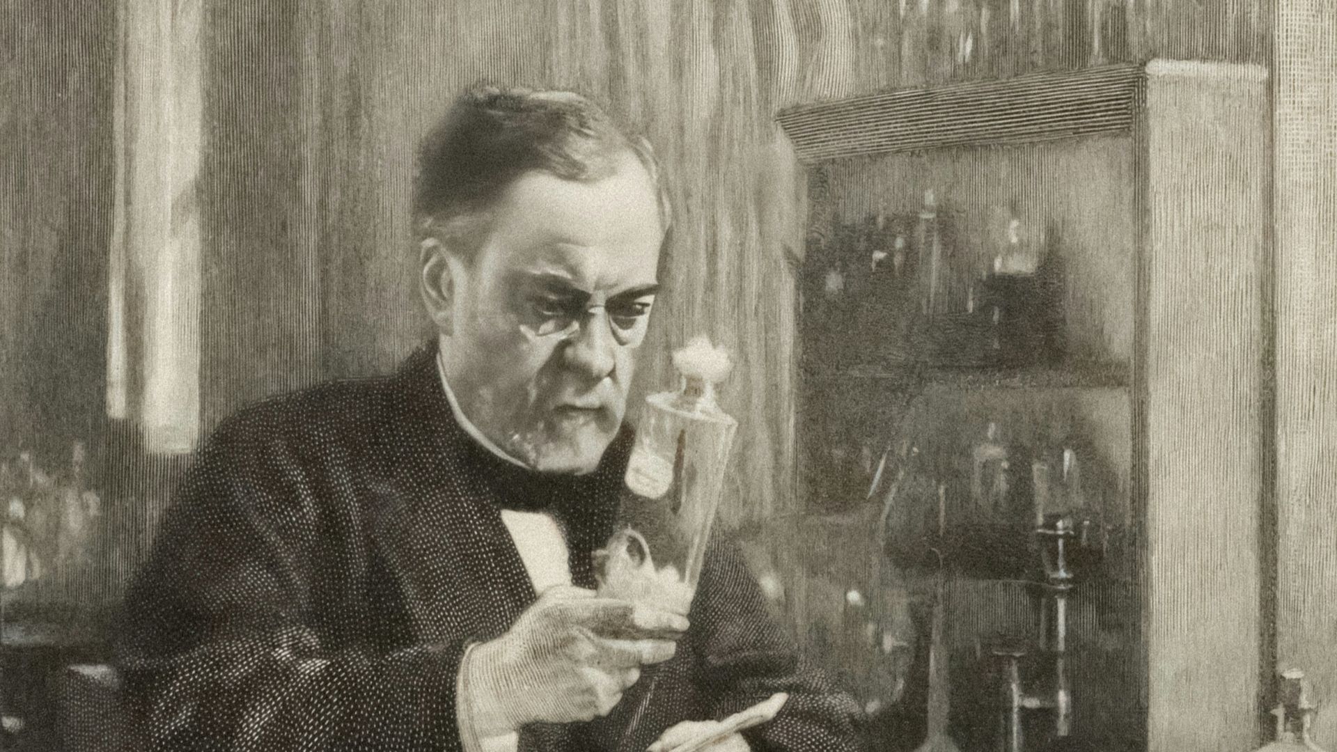 a black and white photo of a man in a lab
