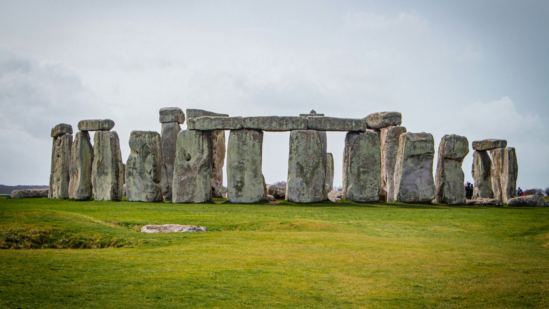 a large stone structure in the middle of a field
