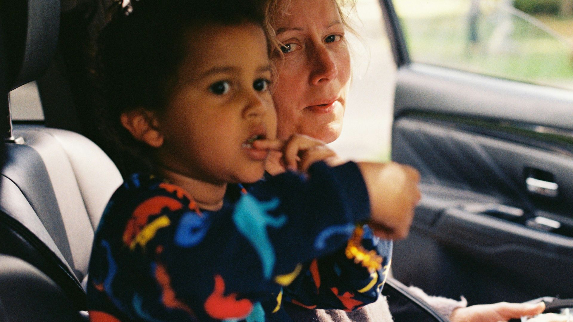 a person and a child in a car