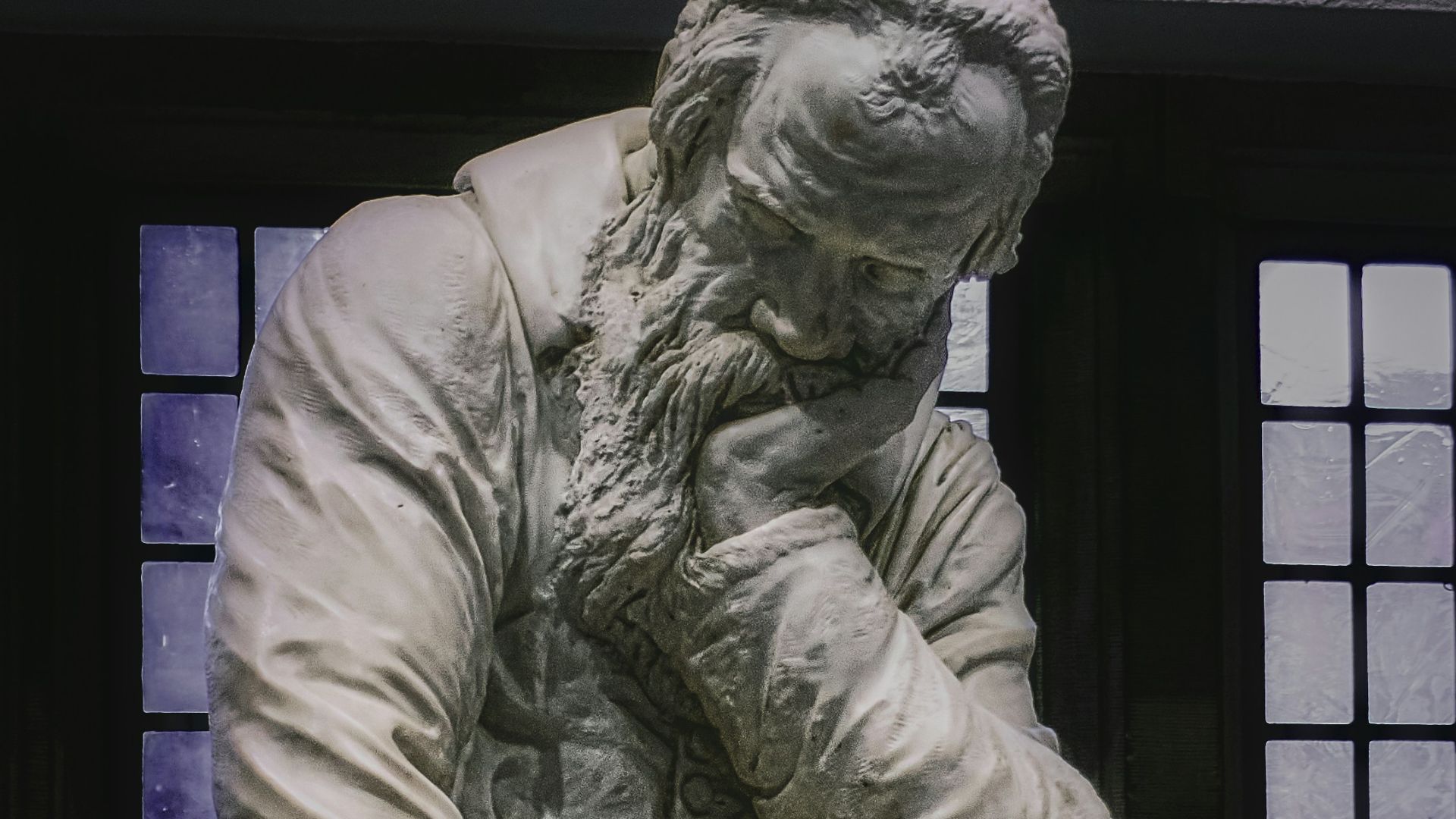 woman in dress statue in grayscale photography