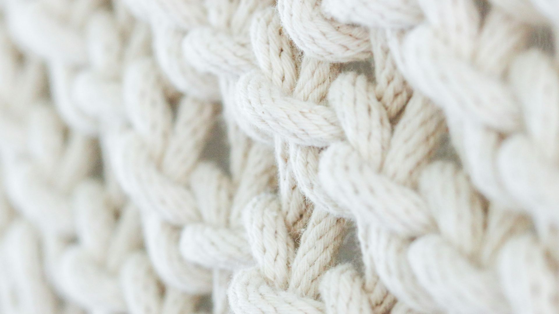 white knit textile on brown wooden table
