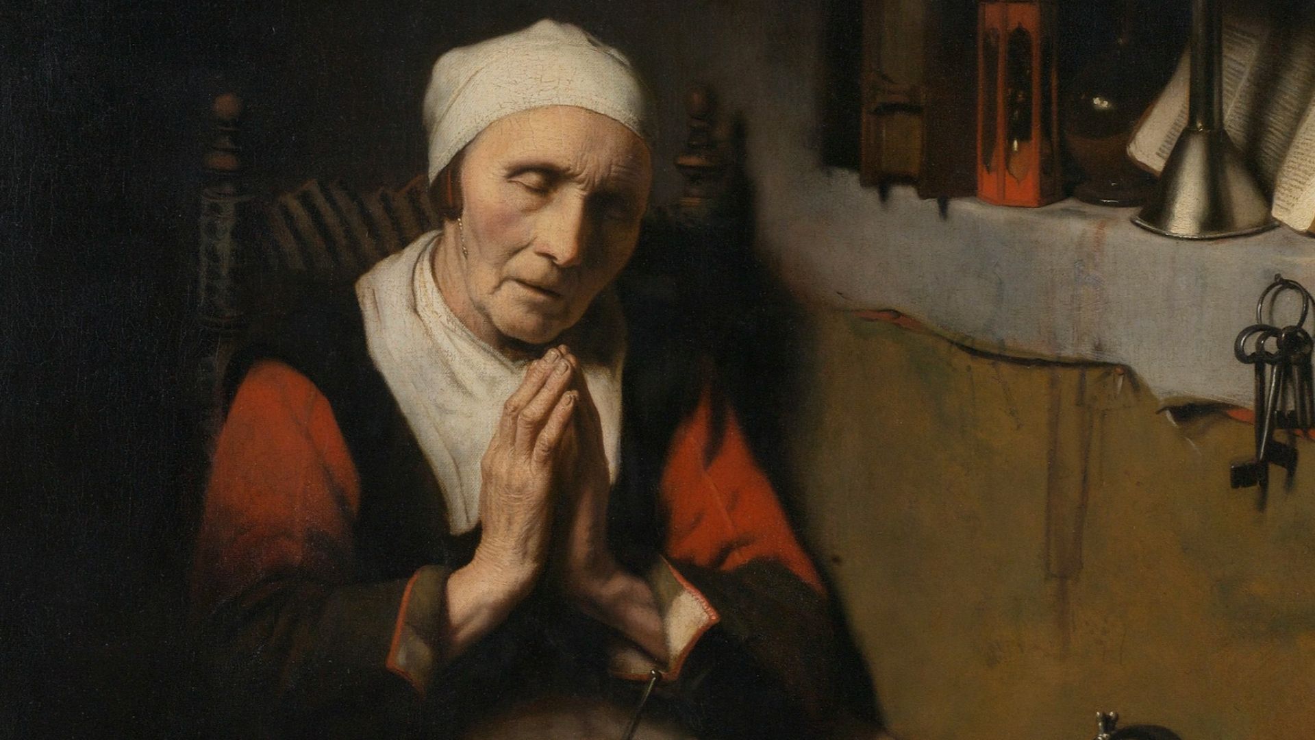 woman in black and white dress sitting on brown couch