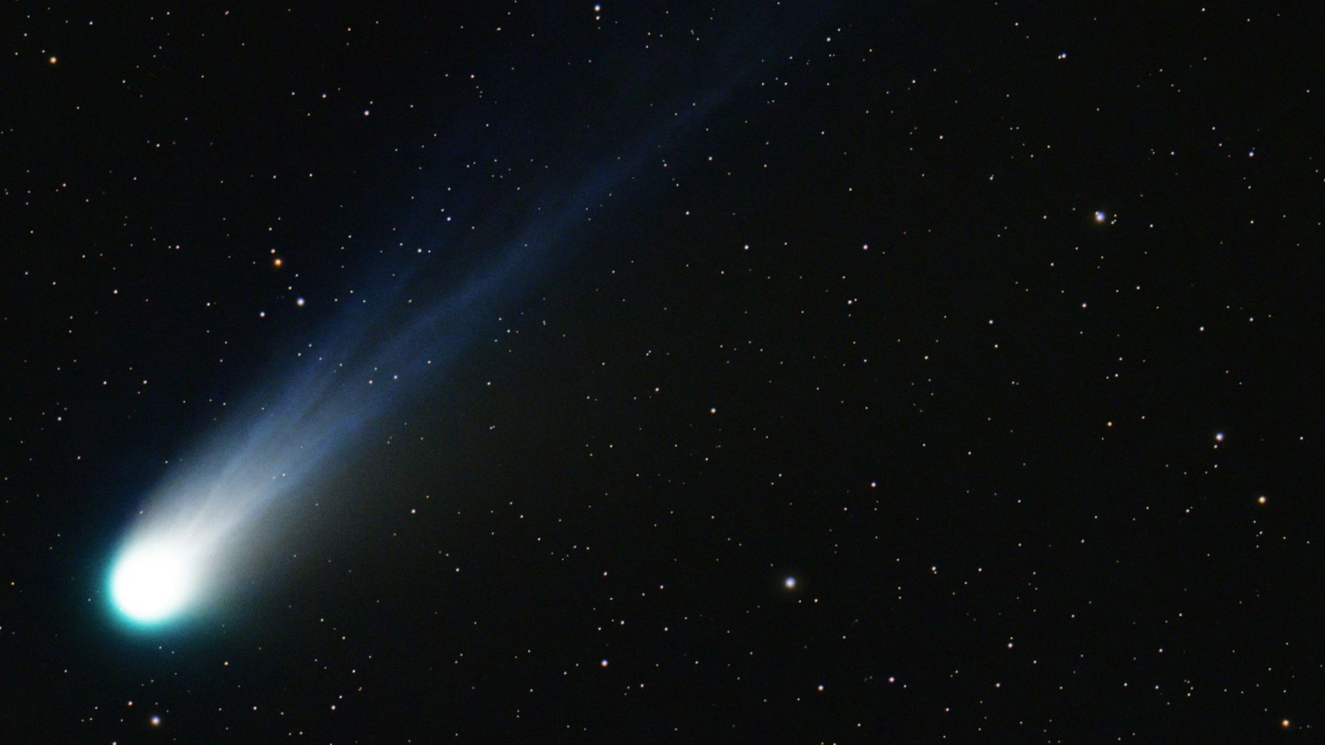 a bright blue object in the sky with stars