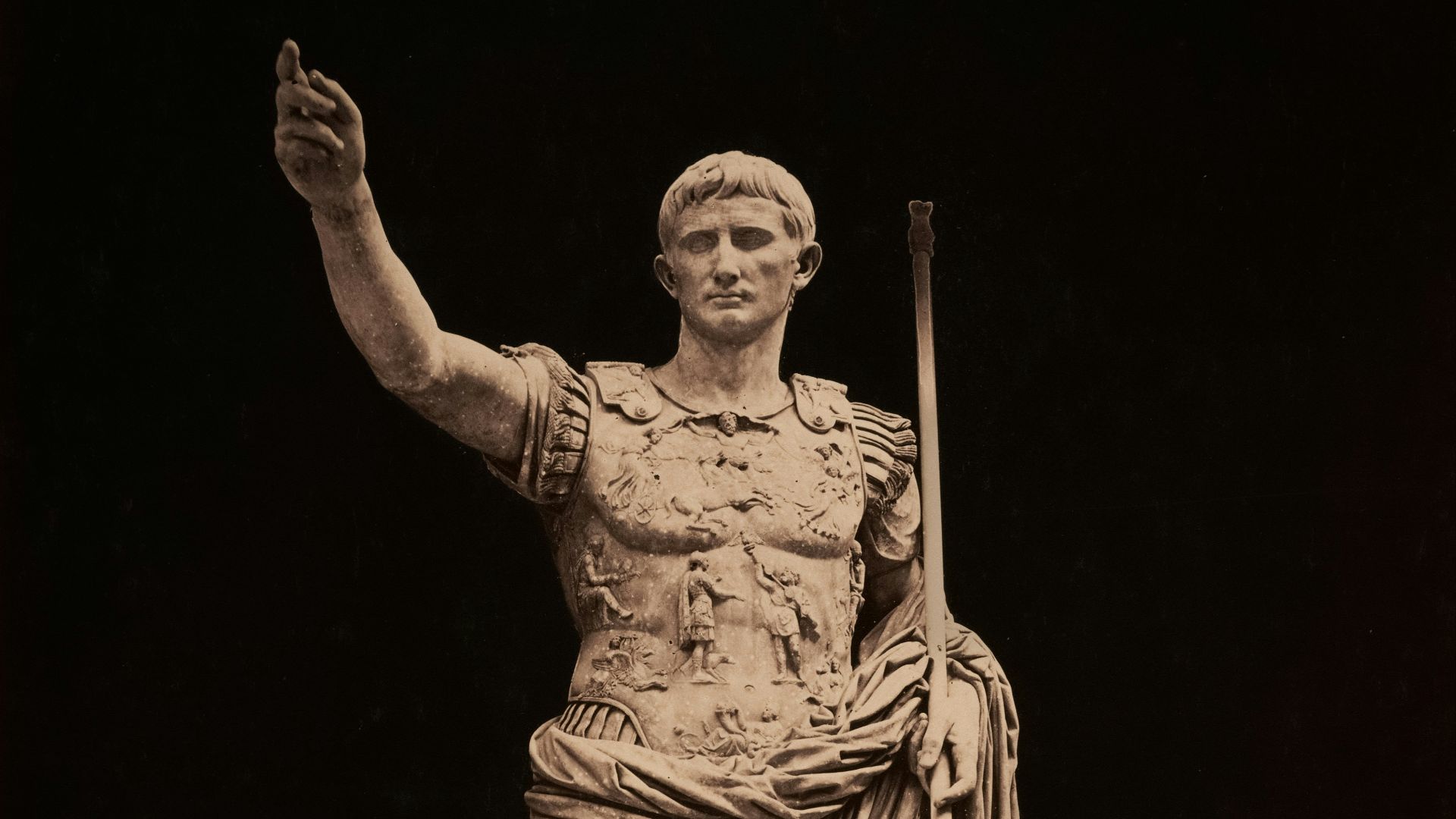Statue of roman emperor augustus points upward.