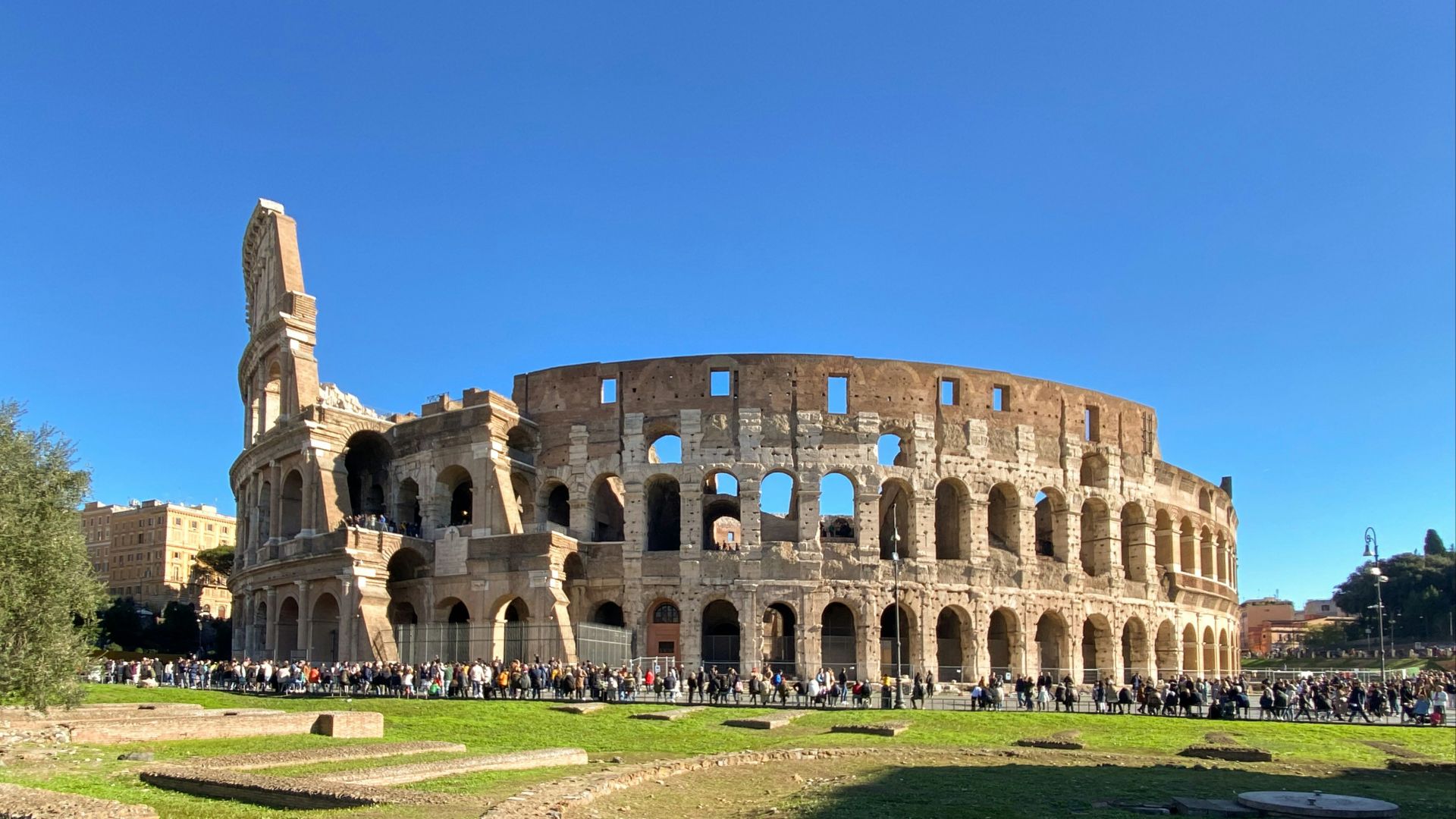 a group of people standing in front of an old building