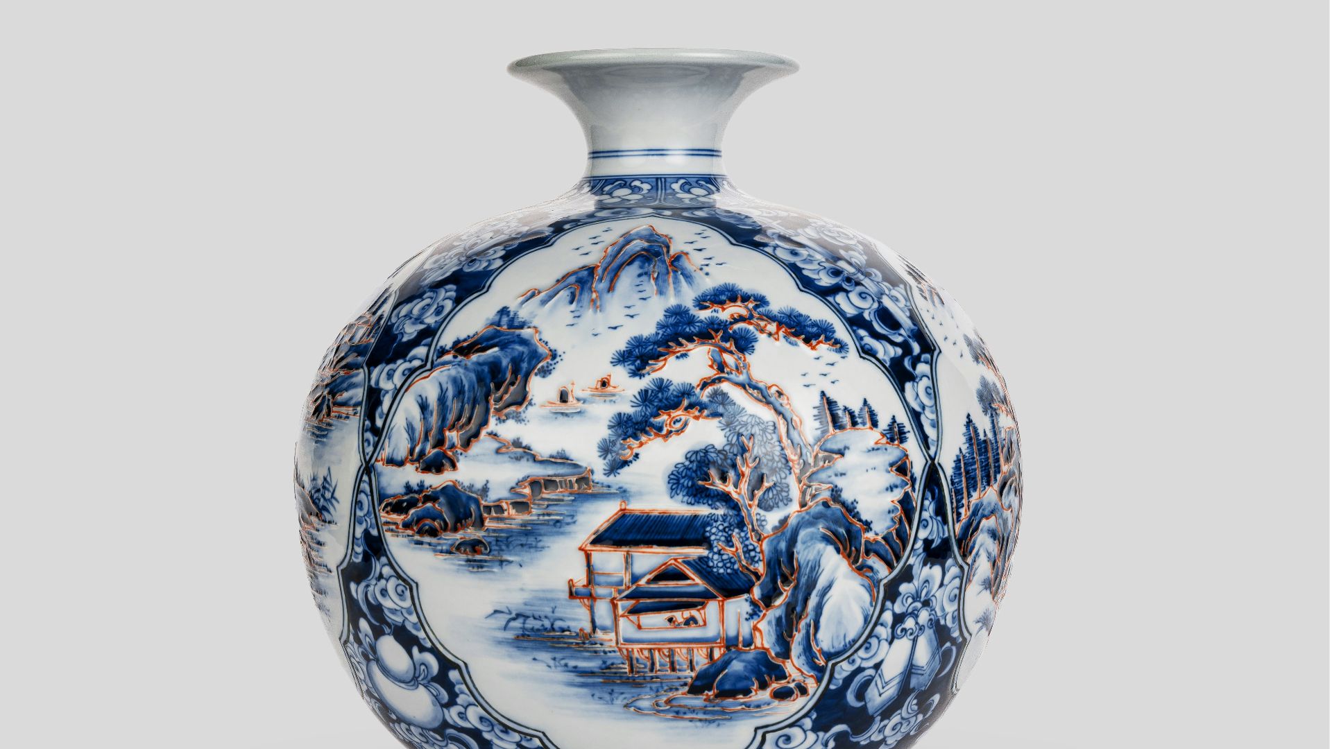 A blue and white vase sitting on top of a table