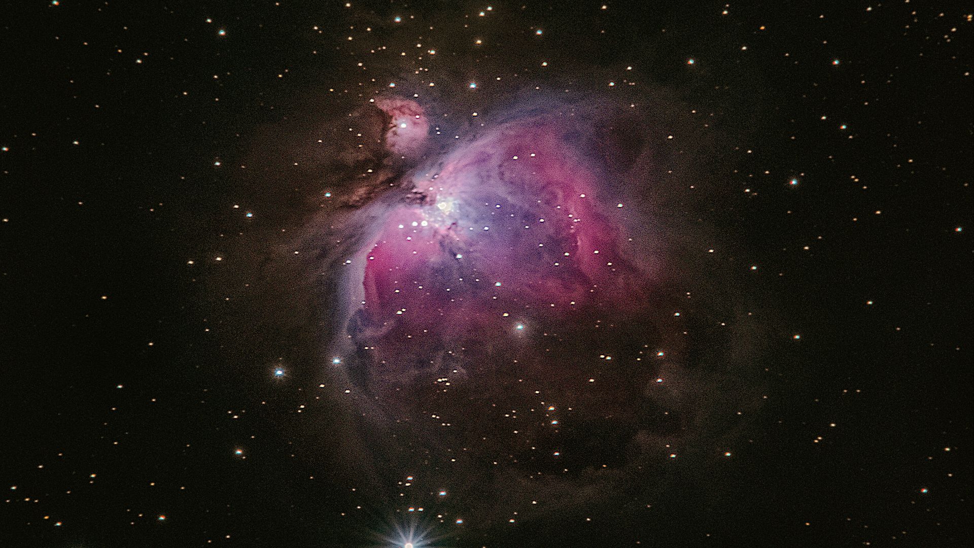 two stars in the middle of a black sky