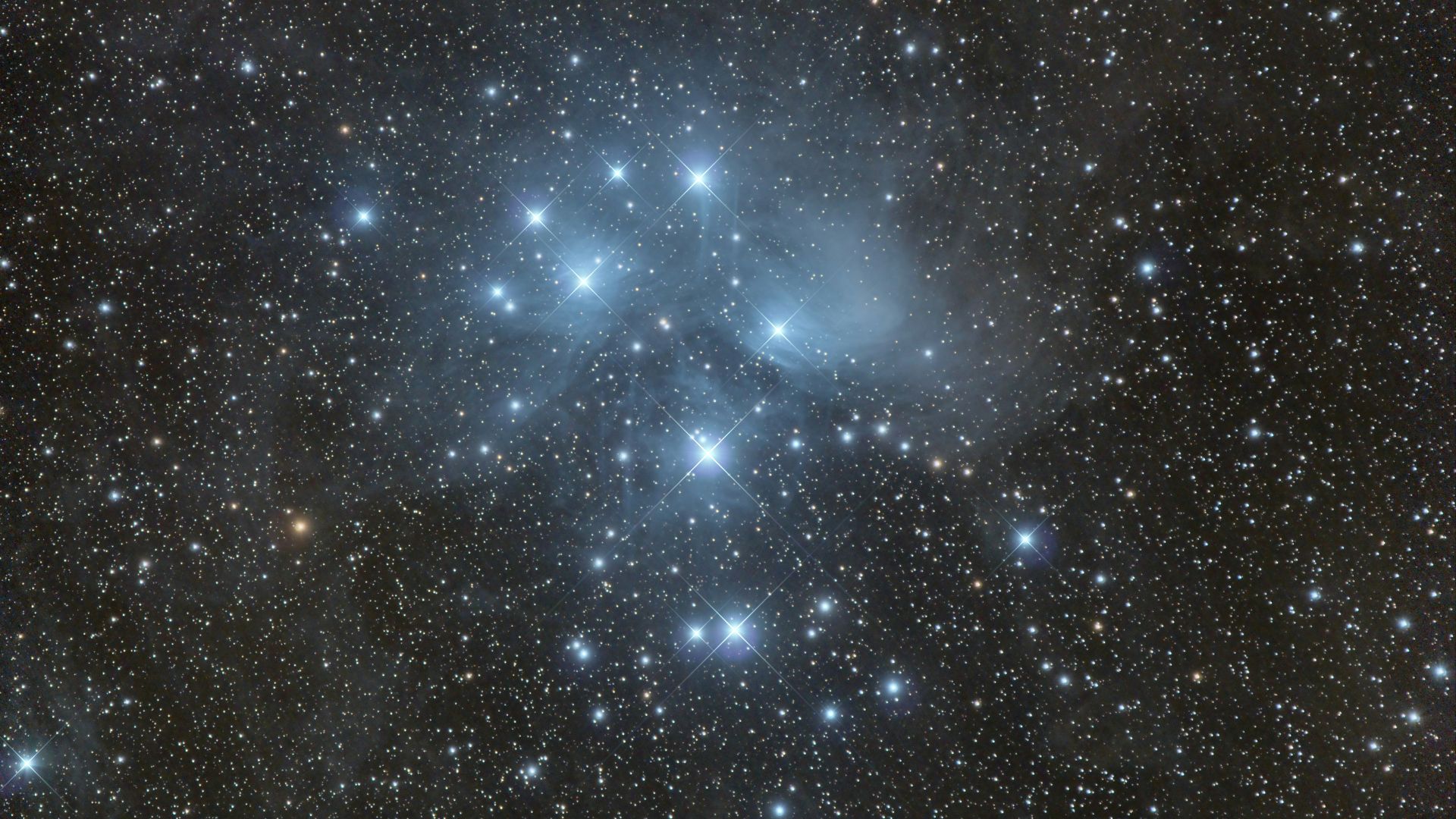 a cluster of stars in the sky