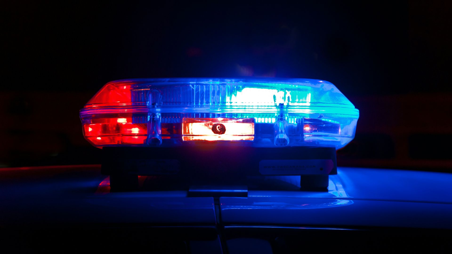 blue bmw car in a dark room