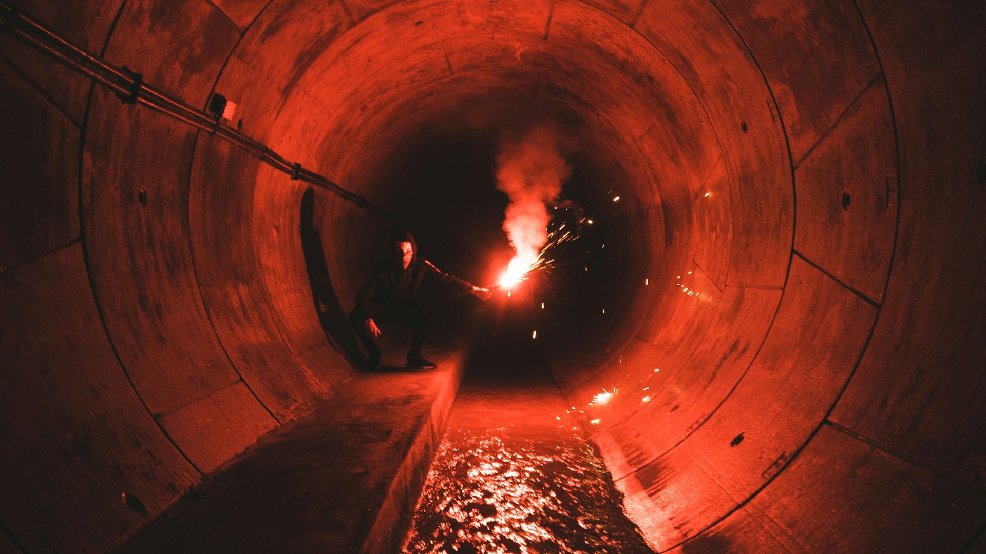 person walking on tunnel during daytime