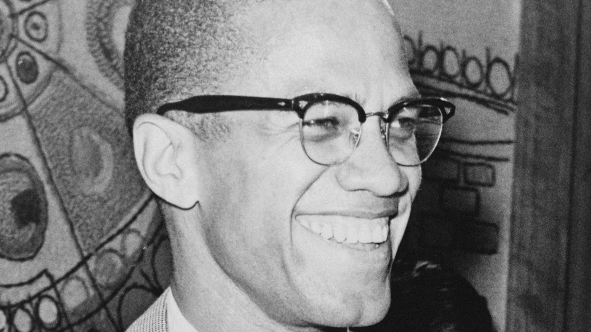 Malcolm X, half-length portrait, facing right.