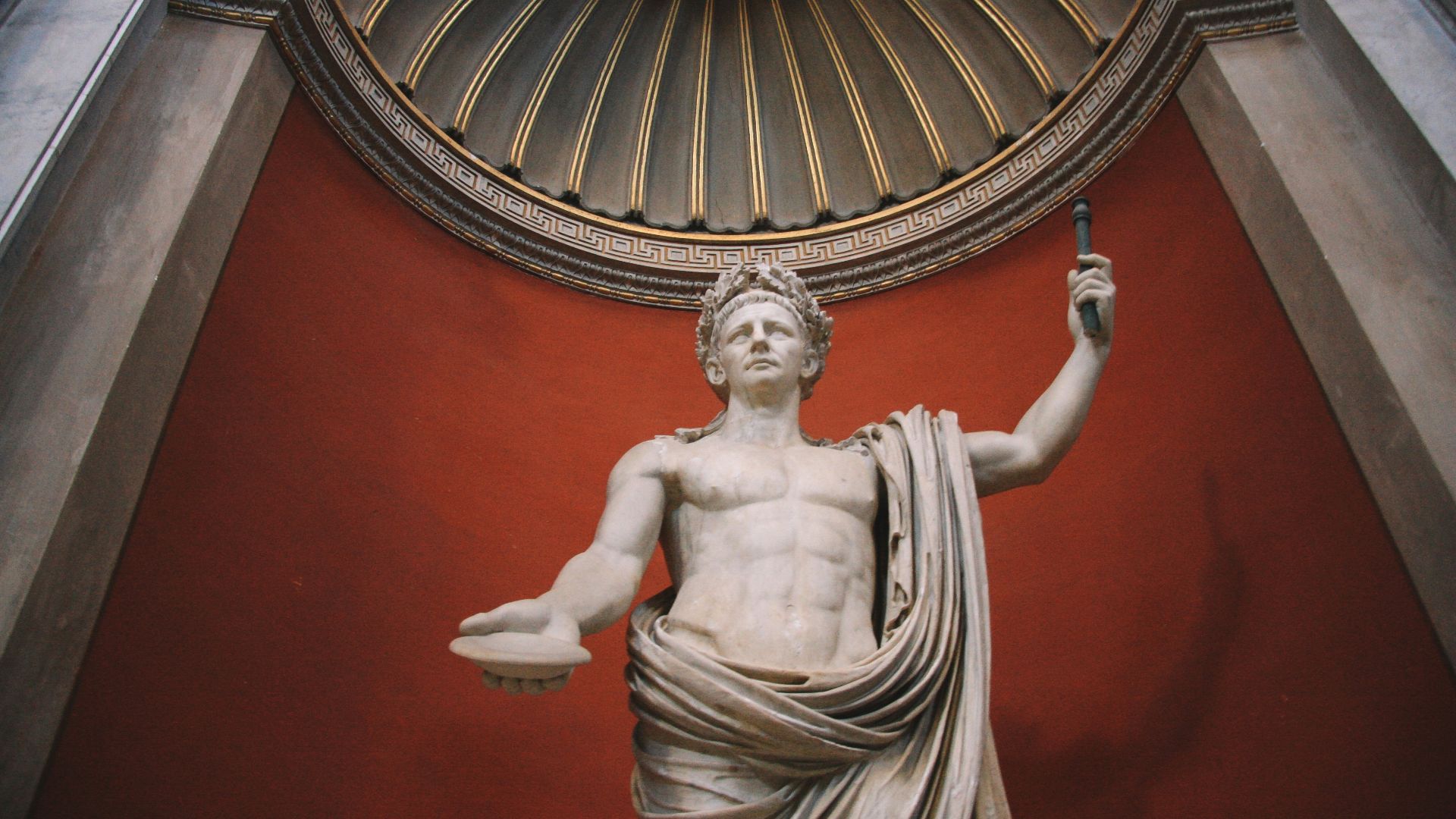 a statue of a man holding a staff