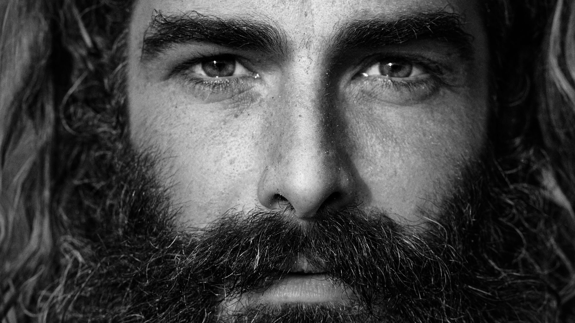 a man with long hair and a beard