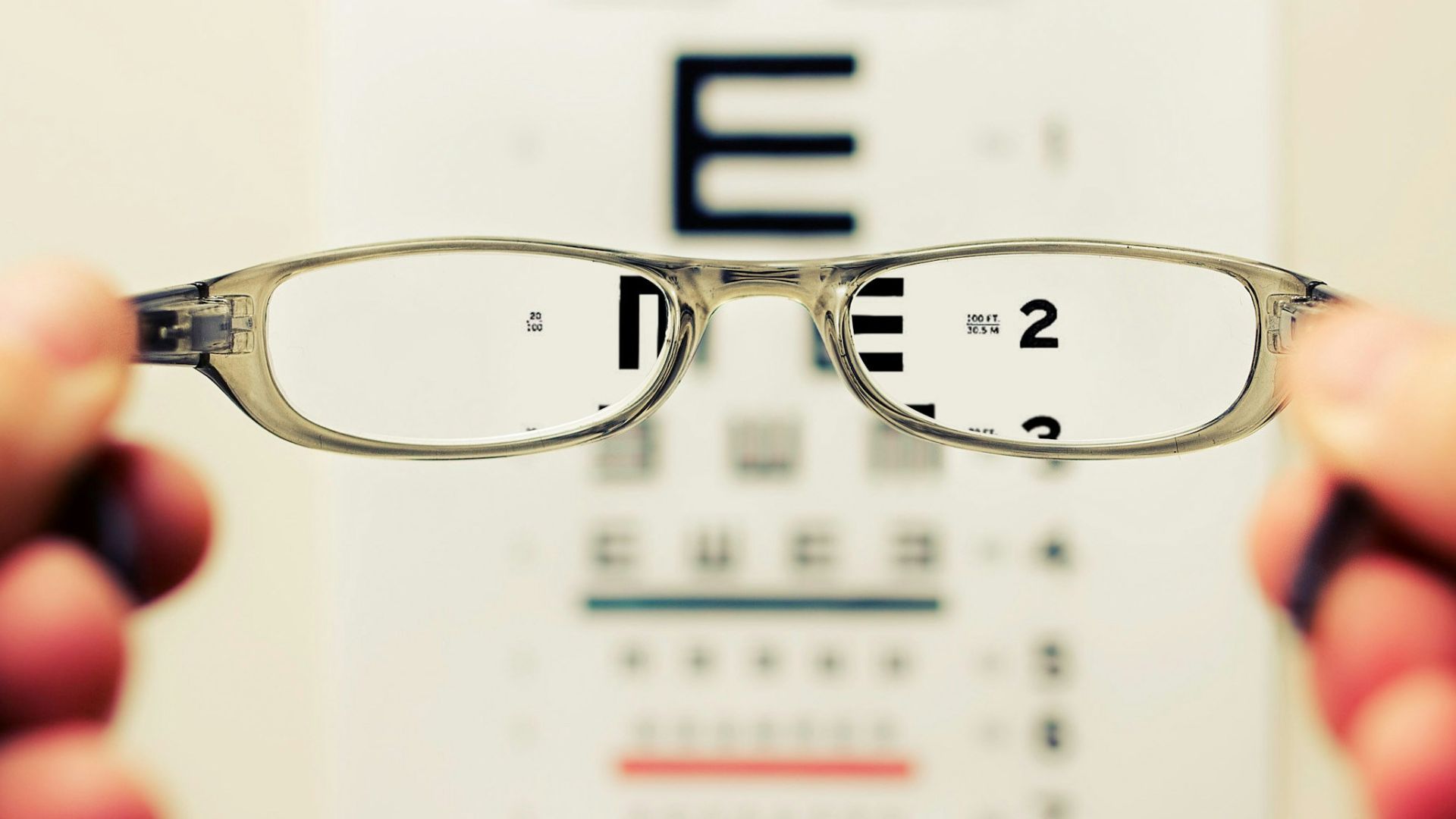 person holding eyeglasses