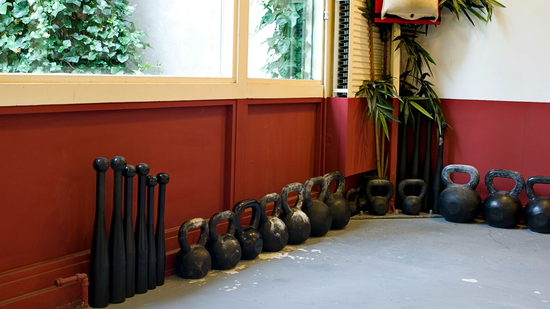black kettle bell on brown wooden desk