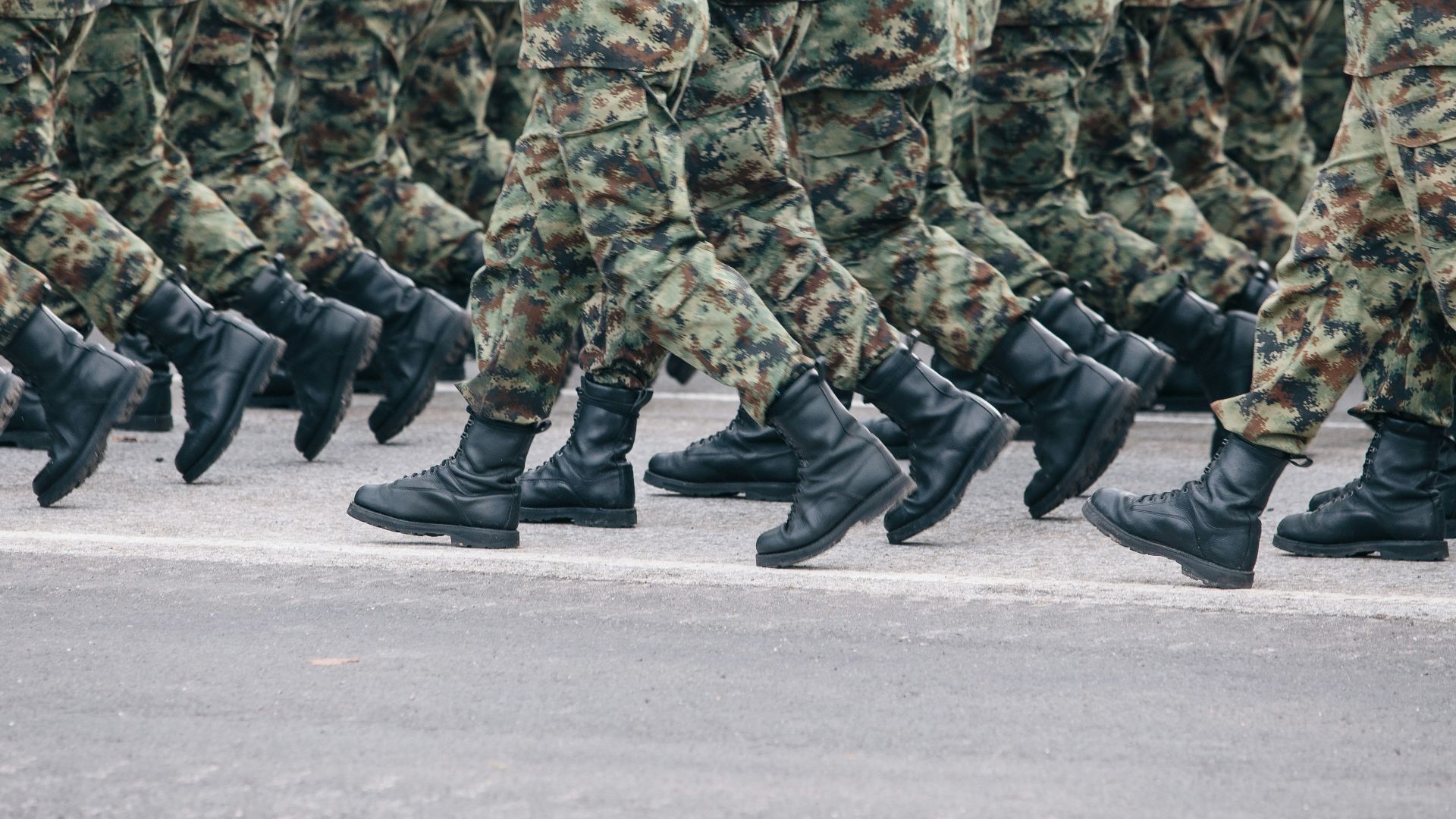 men in green and brown camouflage uniform