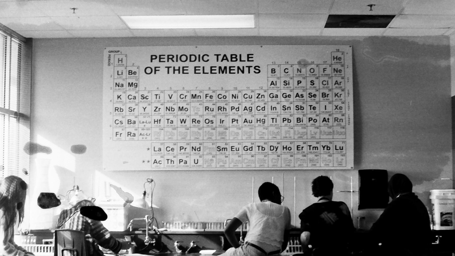 a group of people sitting around a table