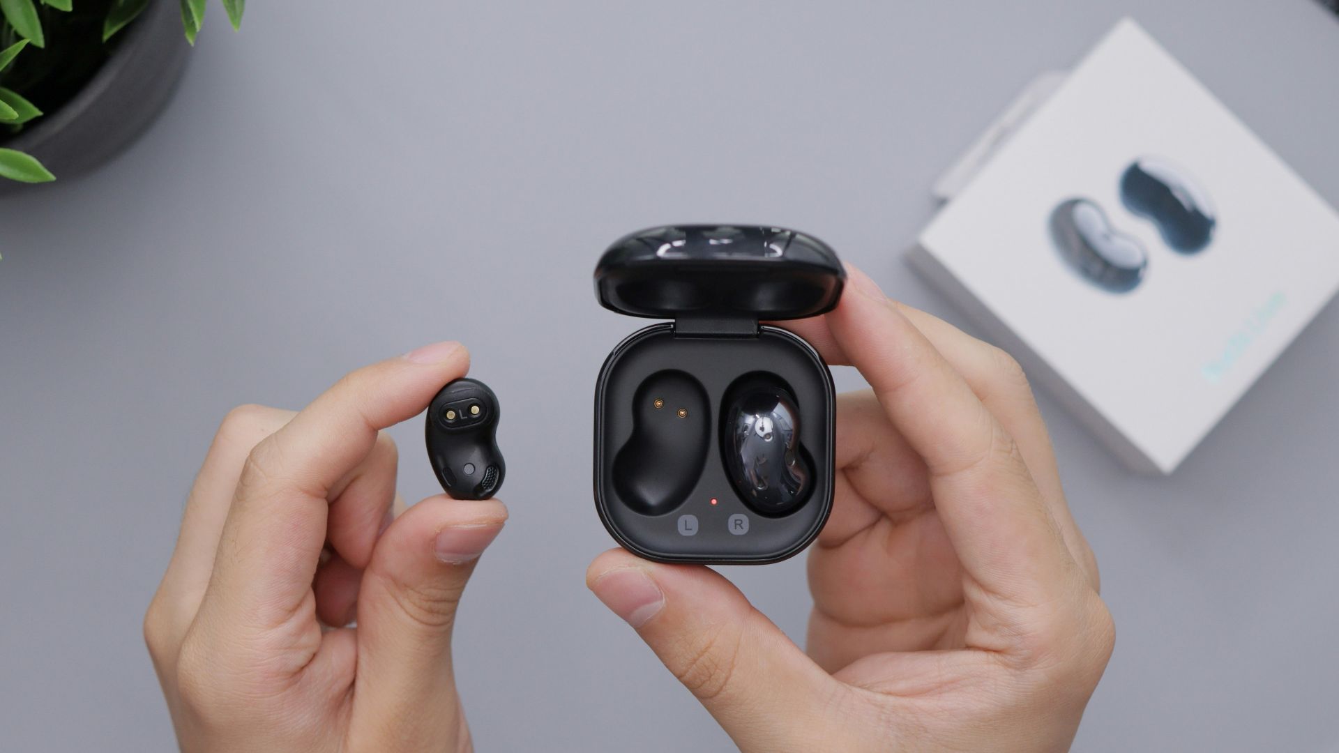 person holding black game controller