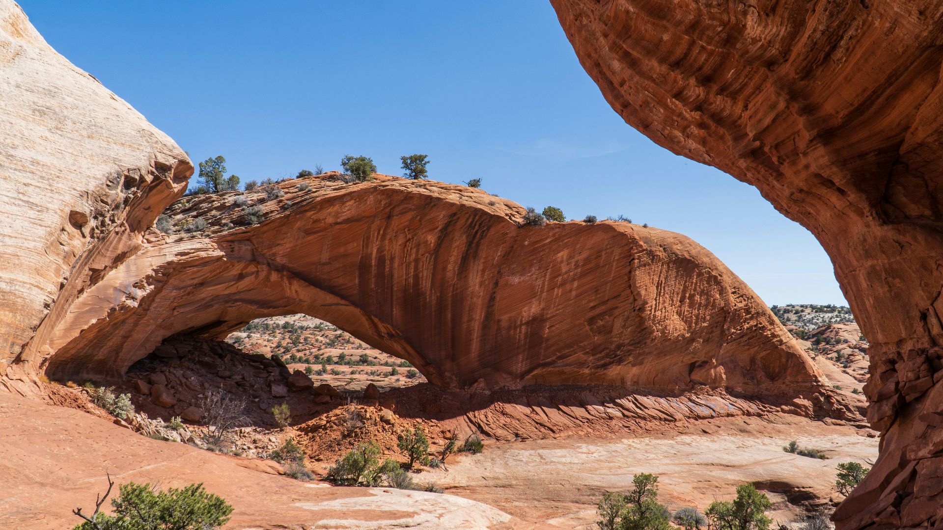 A large rock formation in the middle of a desert