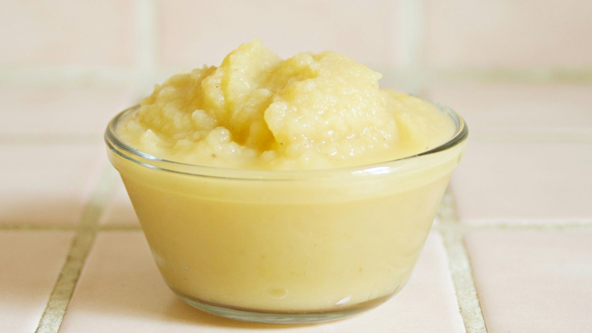 yellow cream in clear glass bowl