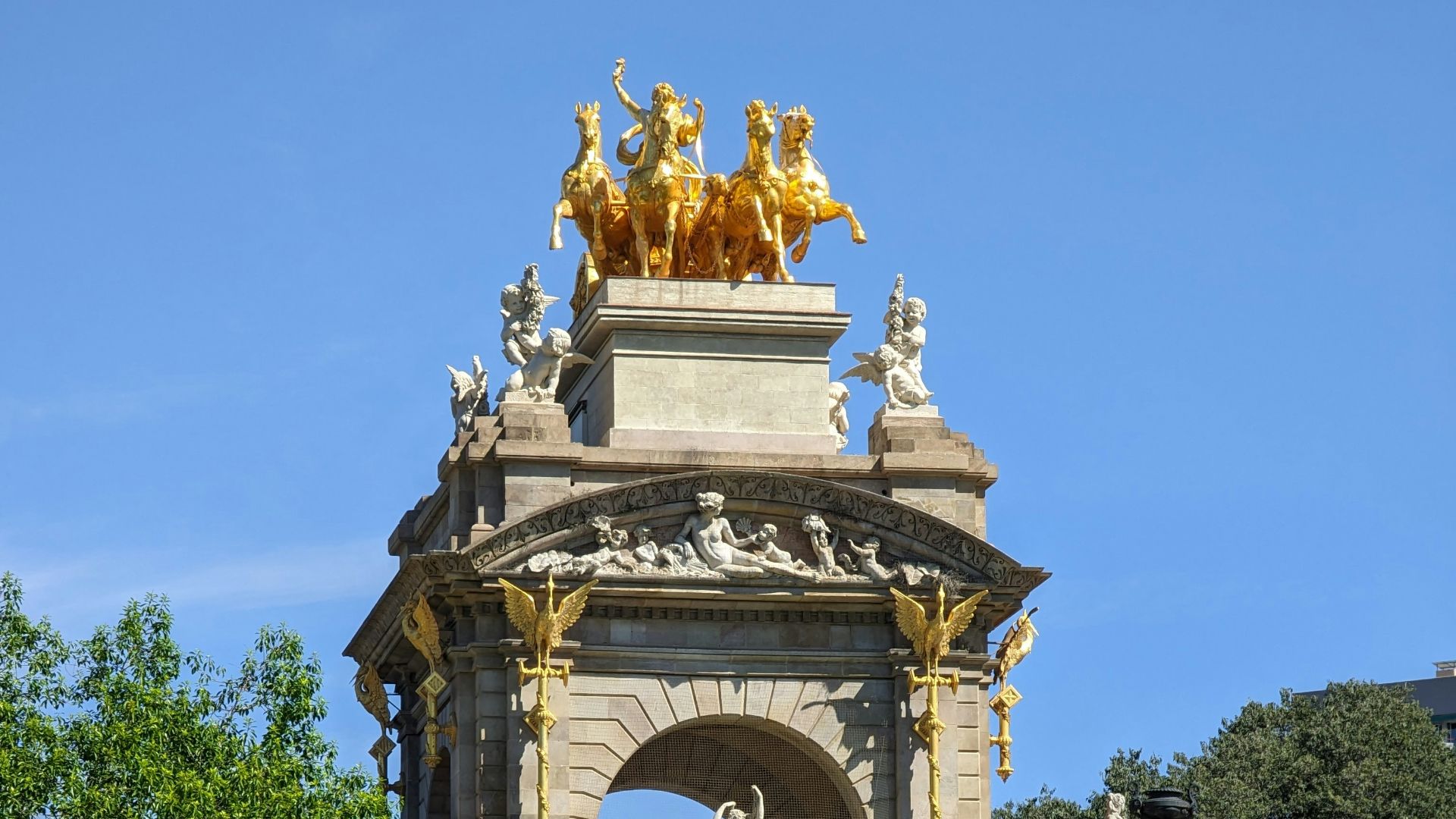 a large fountain with statues on top of it