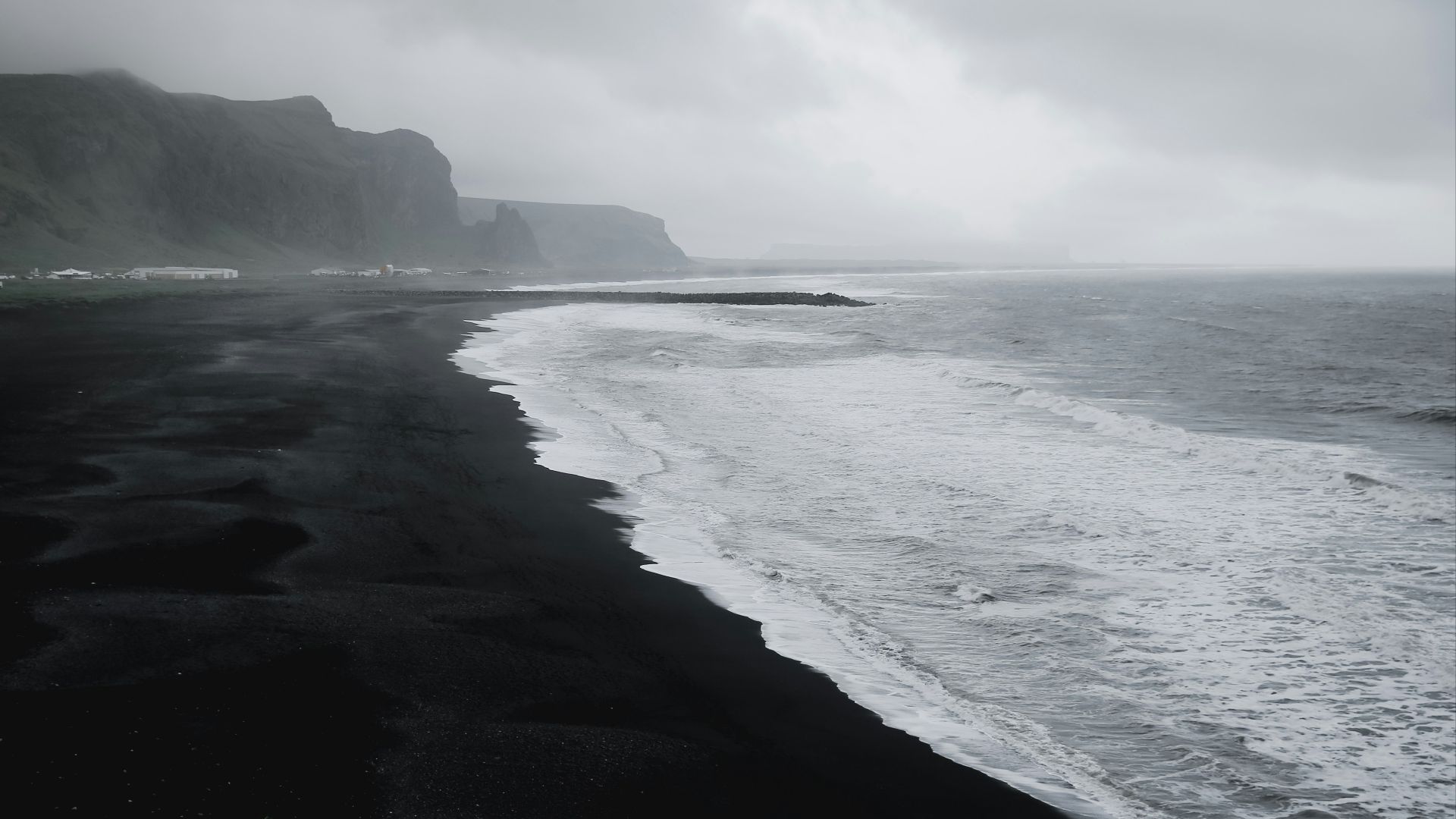 seashore in grayscale photo
