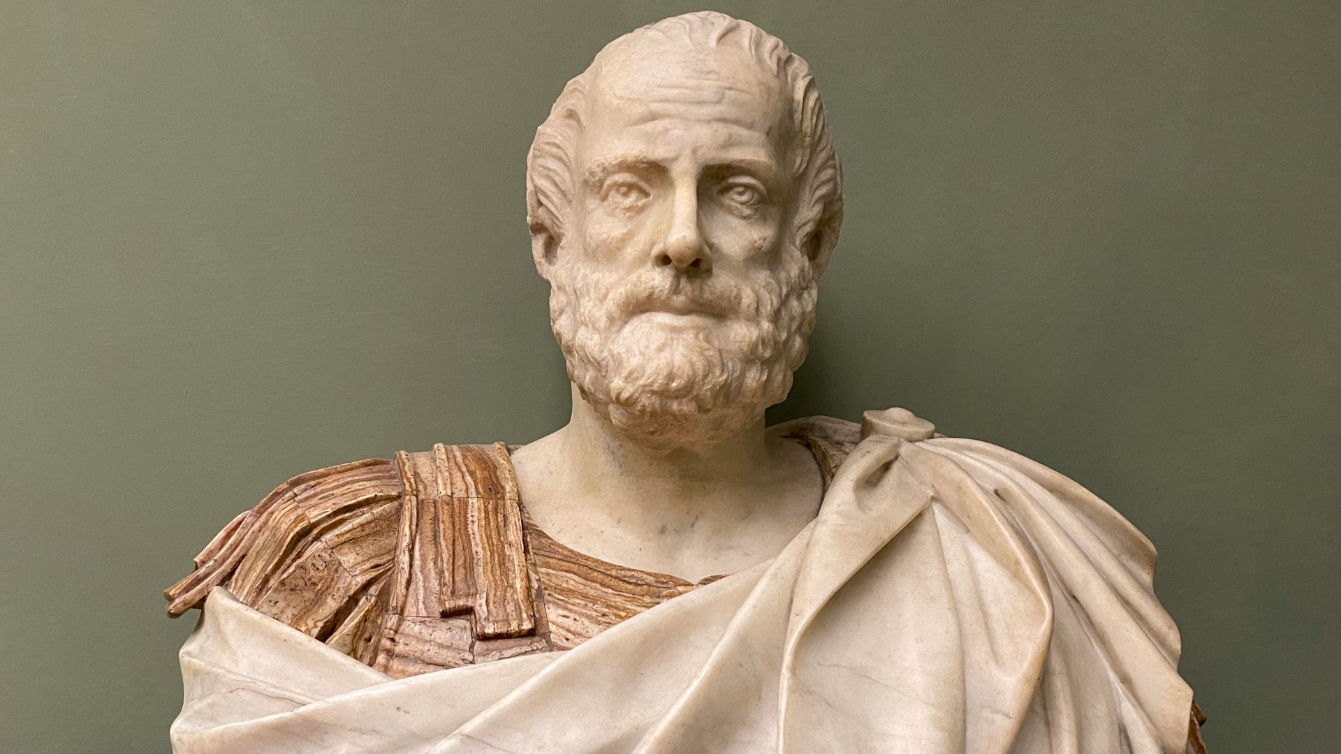 man in brown robe statue