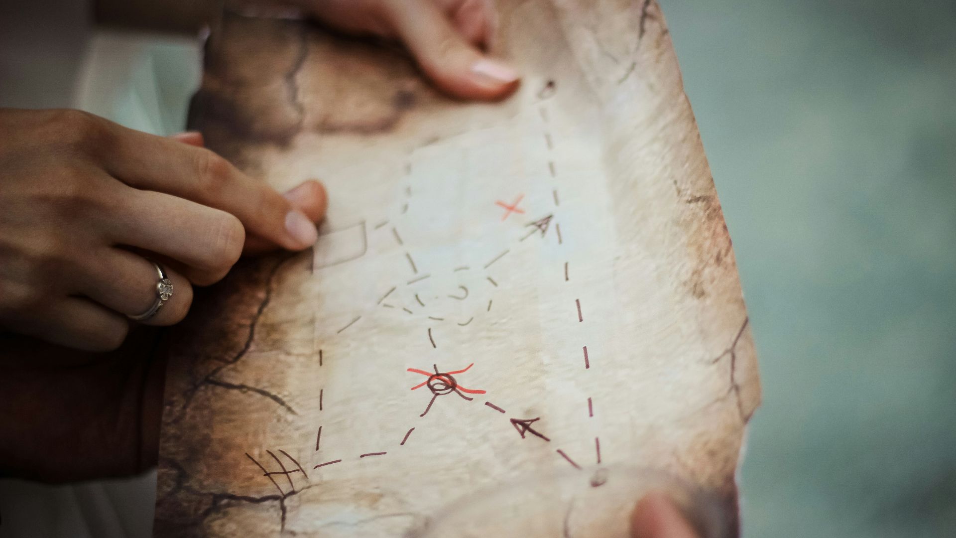 person holding brown map