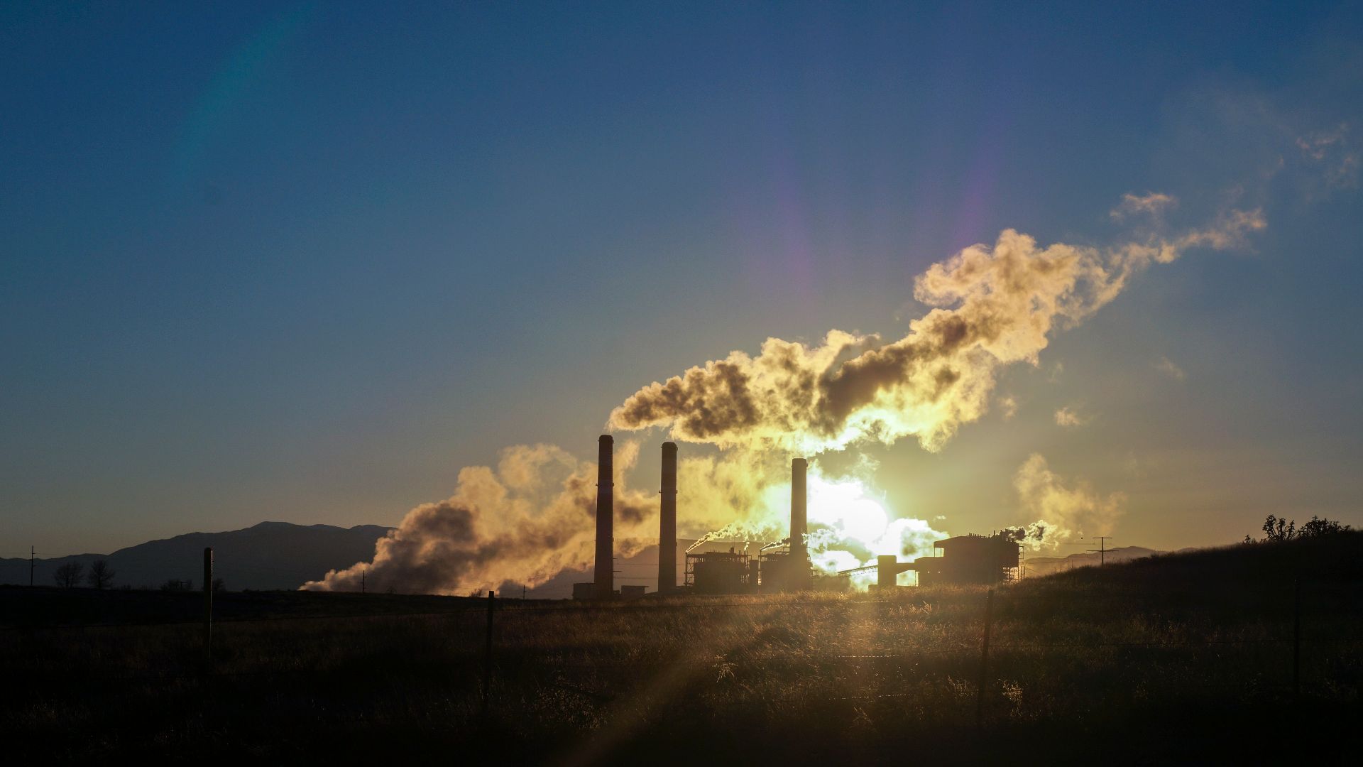 white clouds over city skyline during sunset