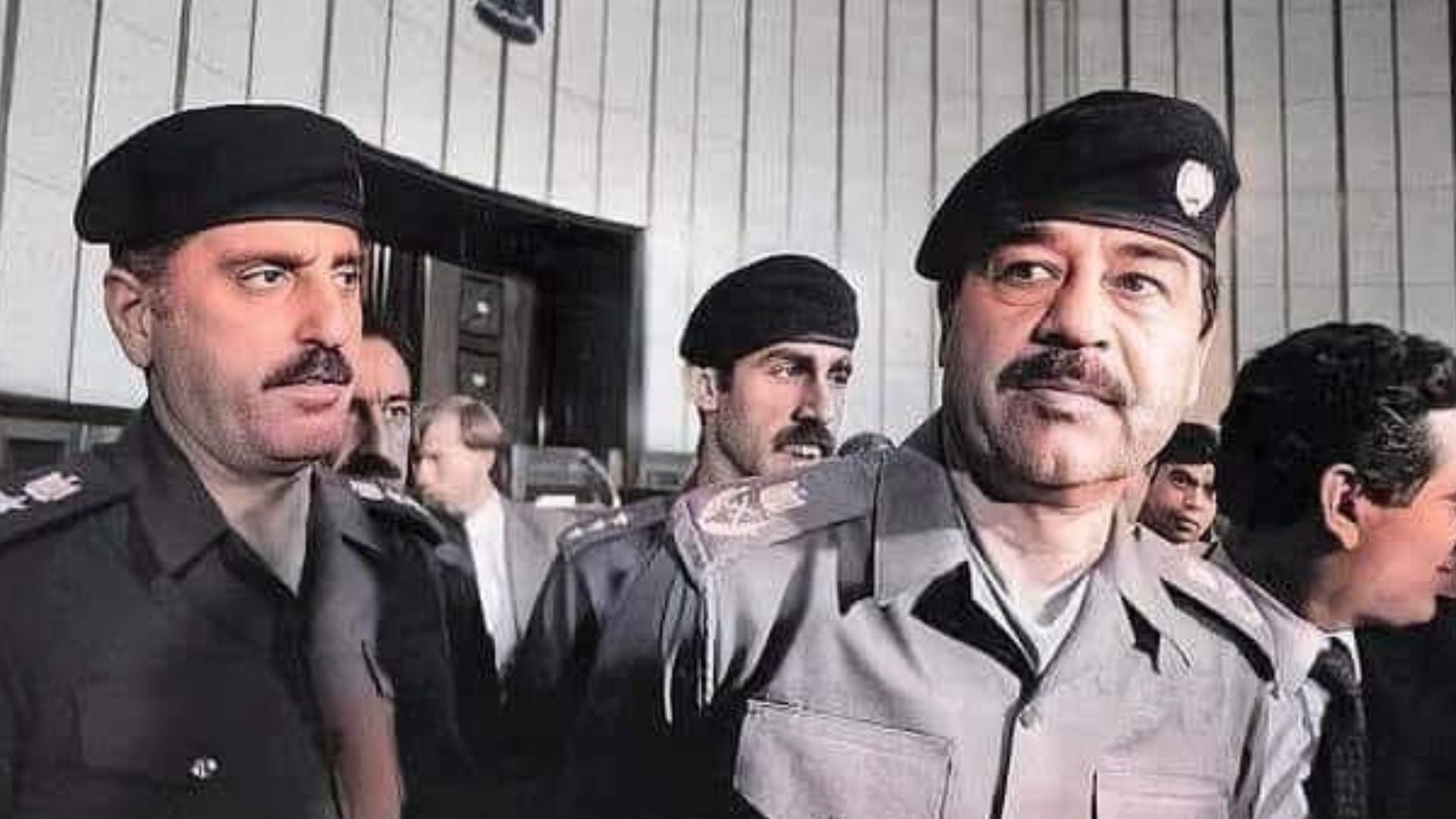 File:Saddam Hussein with army officers.jpg