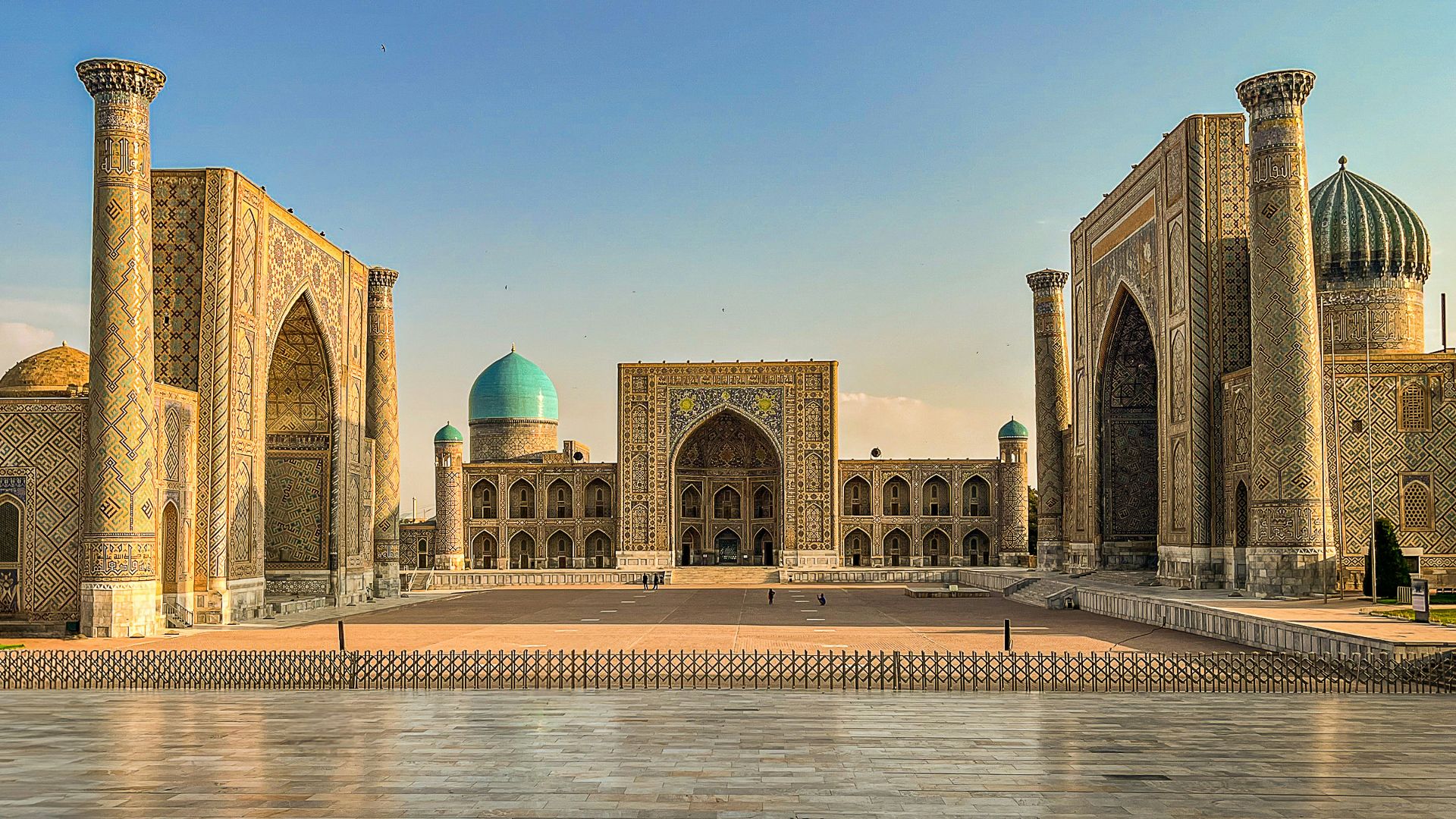 A large building with a blue dome on top of it