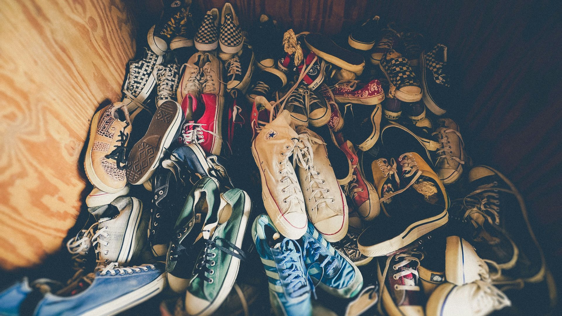 photography of assorted-color shoes lot on box